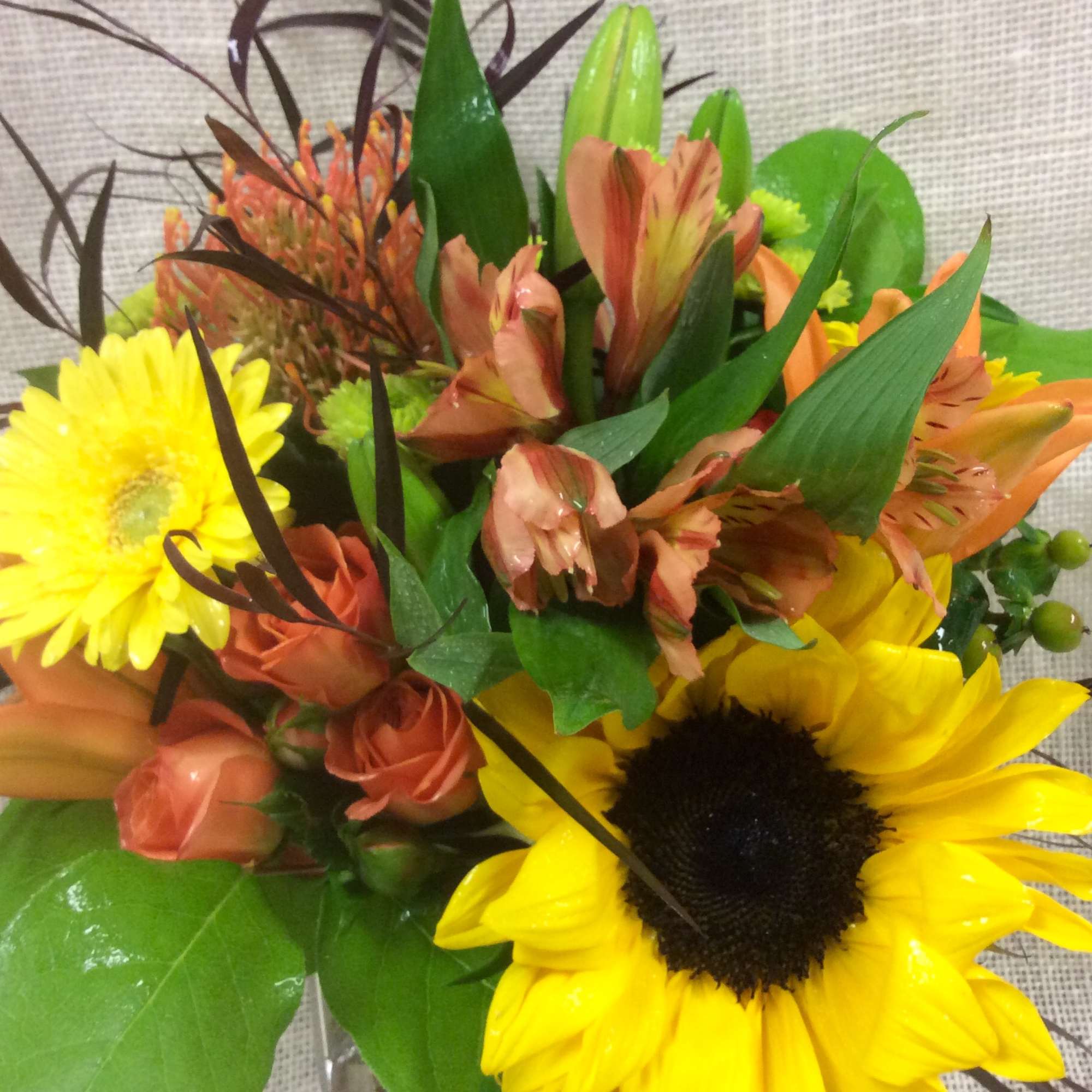 The colors and textures of fall inspire this robust arrangement, with a
