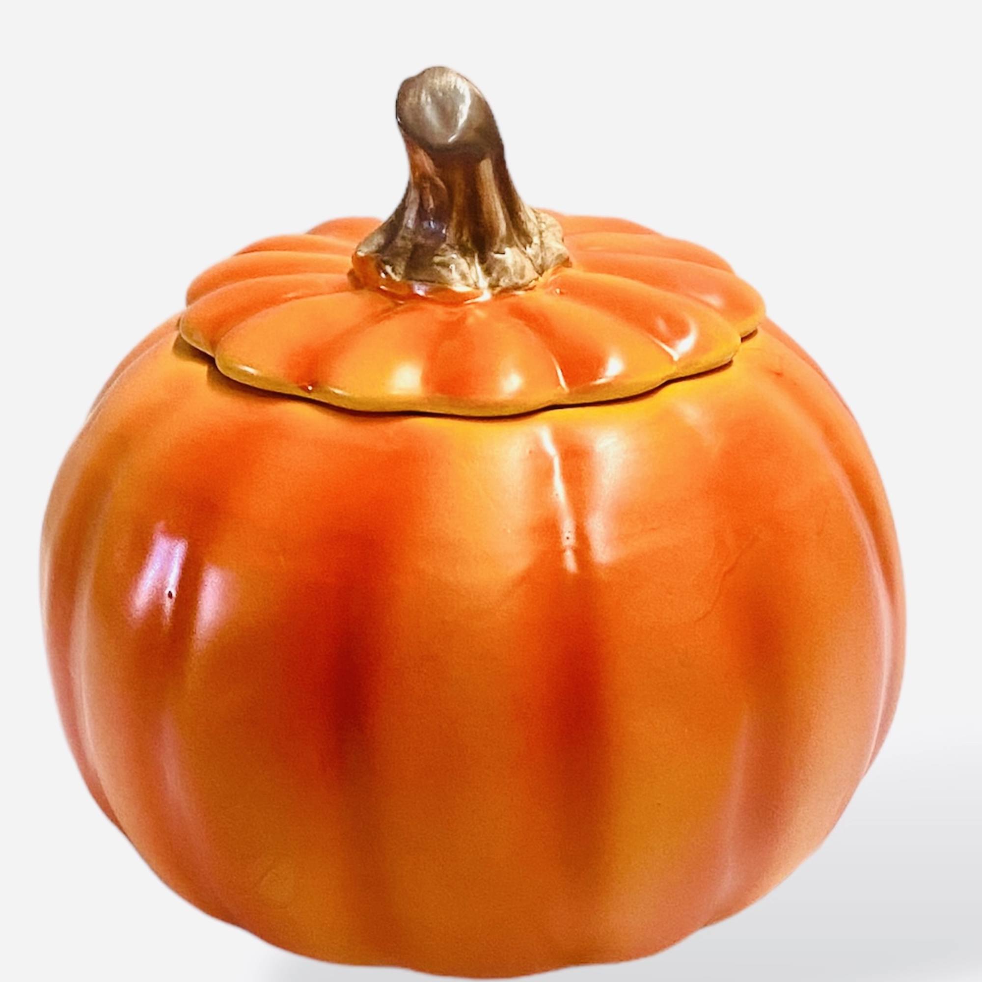 Orange pumpkin-shaped ceramic container with a lid