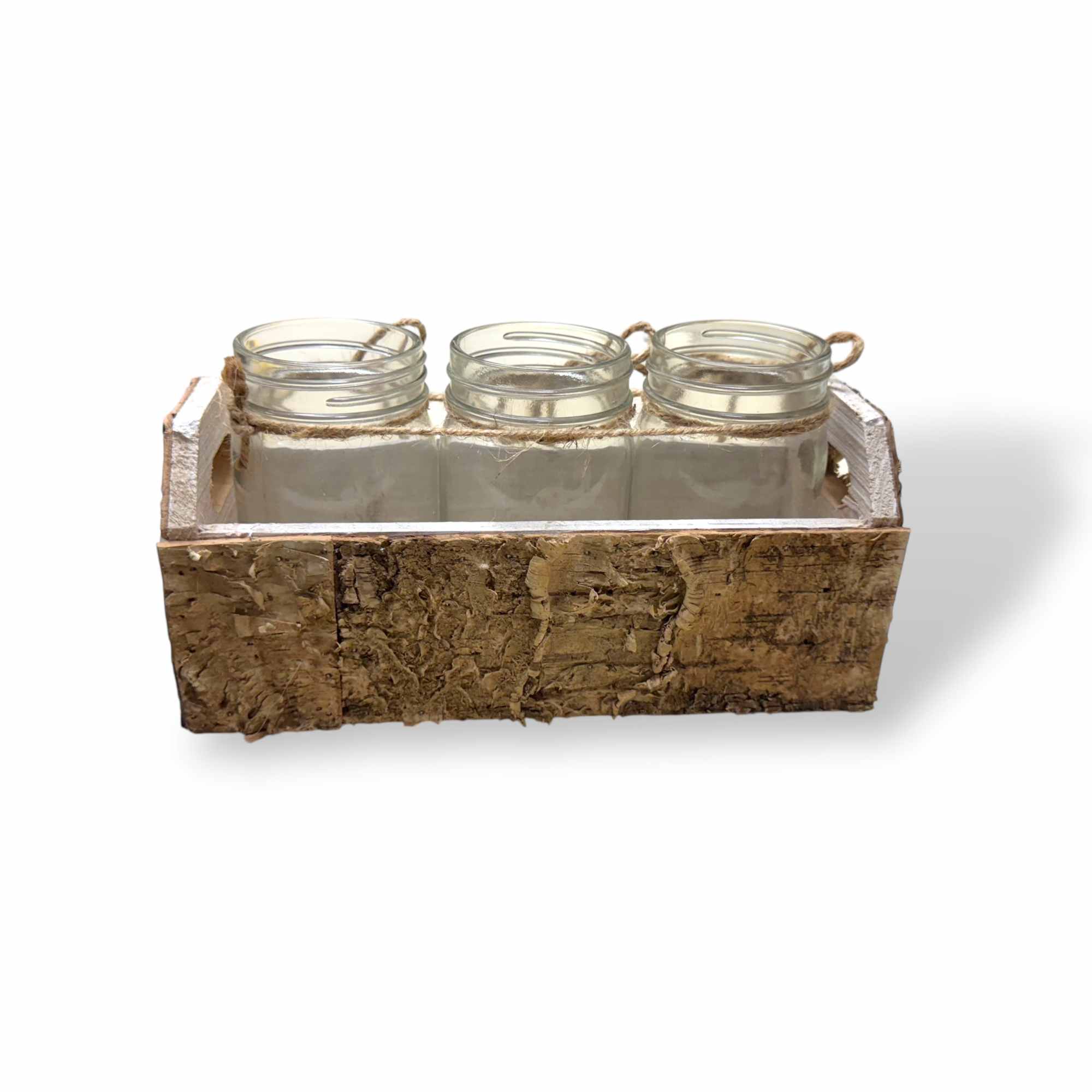 Three small glass jars in a rustic wooden tray