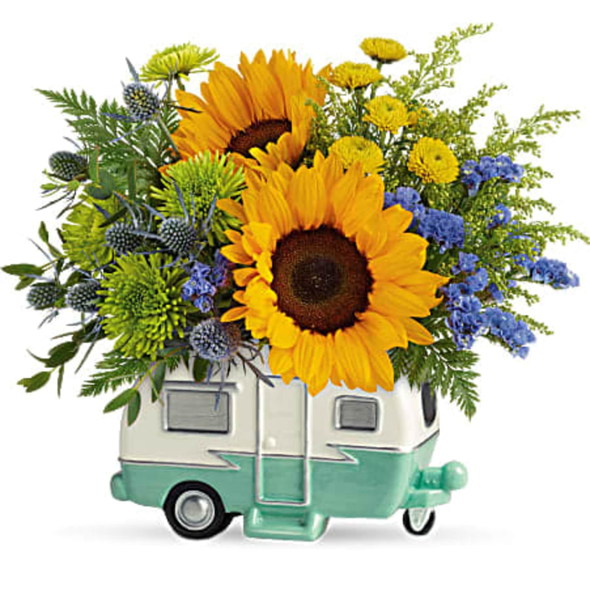 Sunflowers and blue flowers arranged in a small camper-shaped container