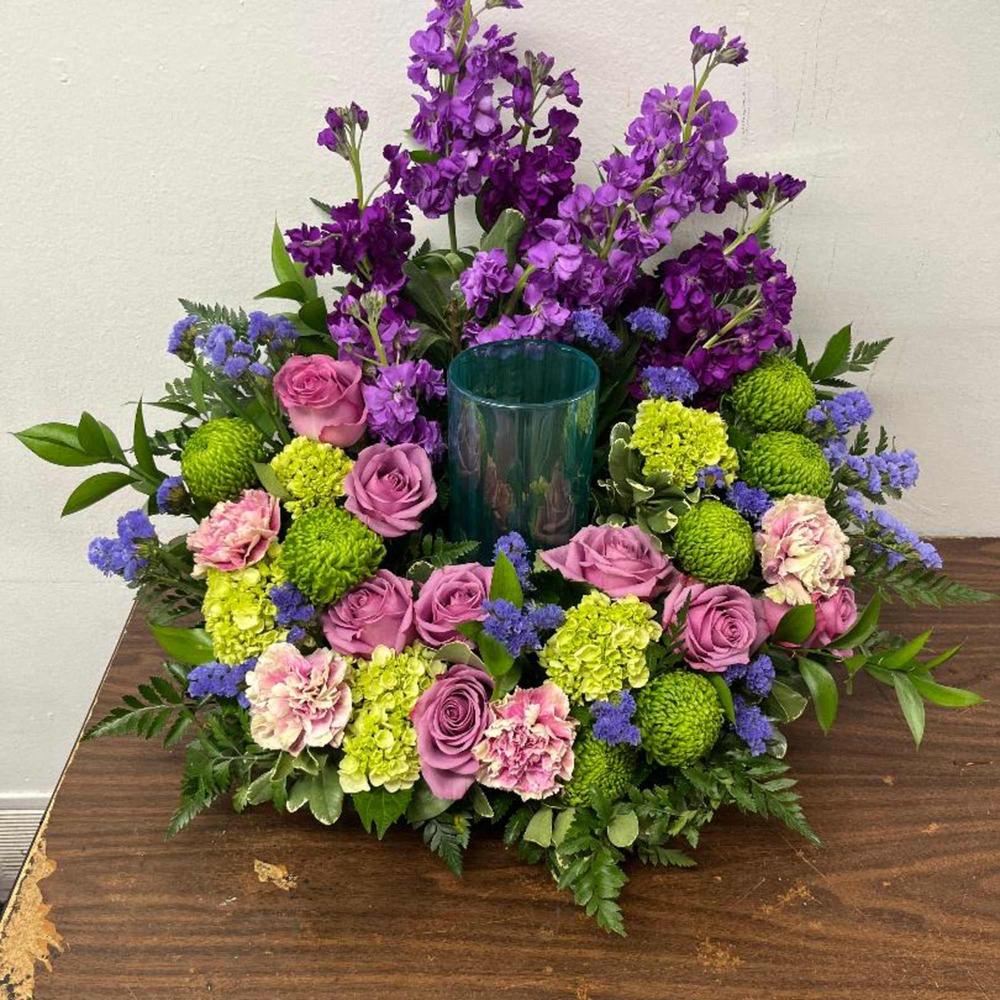 Assortment of pastel flowers and greens. Vase in place of where urn, photo 2 of 3