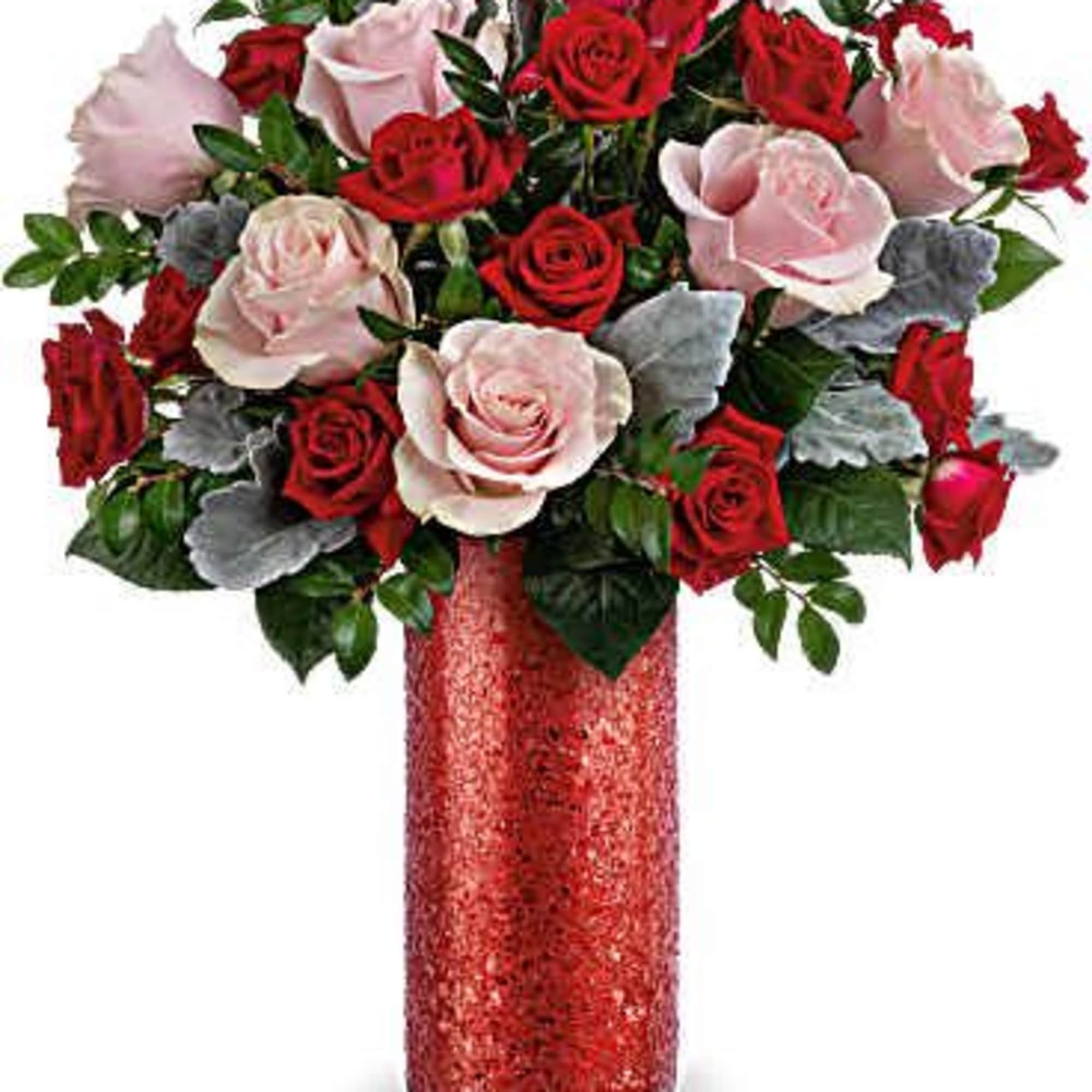 Bouquet of red and pale pink roses in a red vase