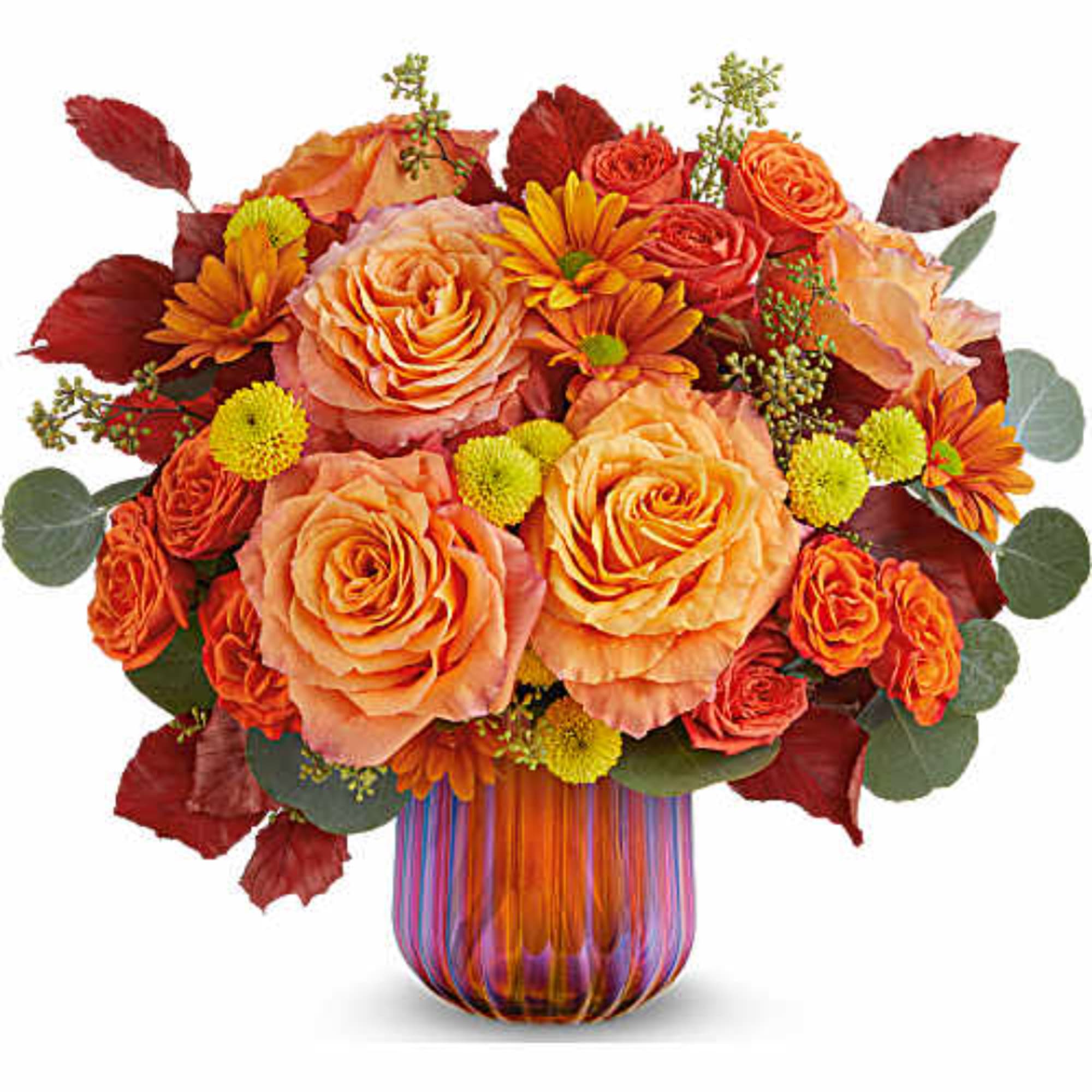 Orange roses and mums in a striped glass vase