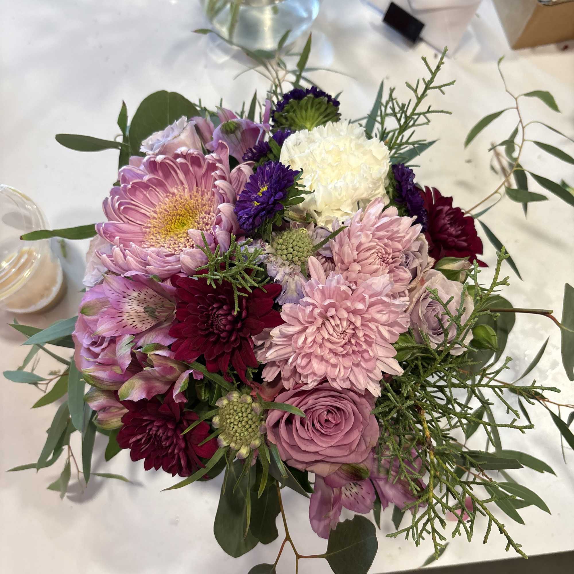 Mixed pink and purple bouquet with chrysanthemums, roses, and alstroemeria