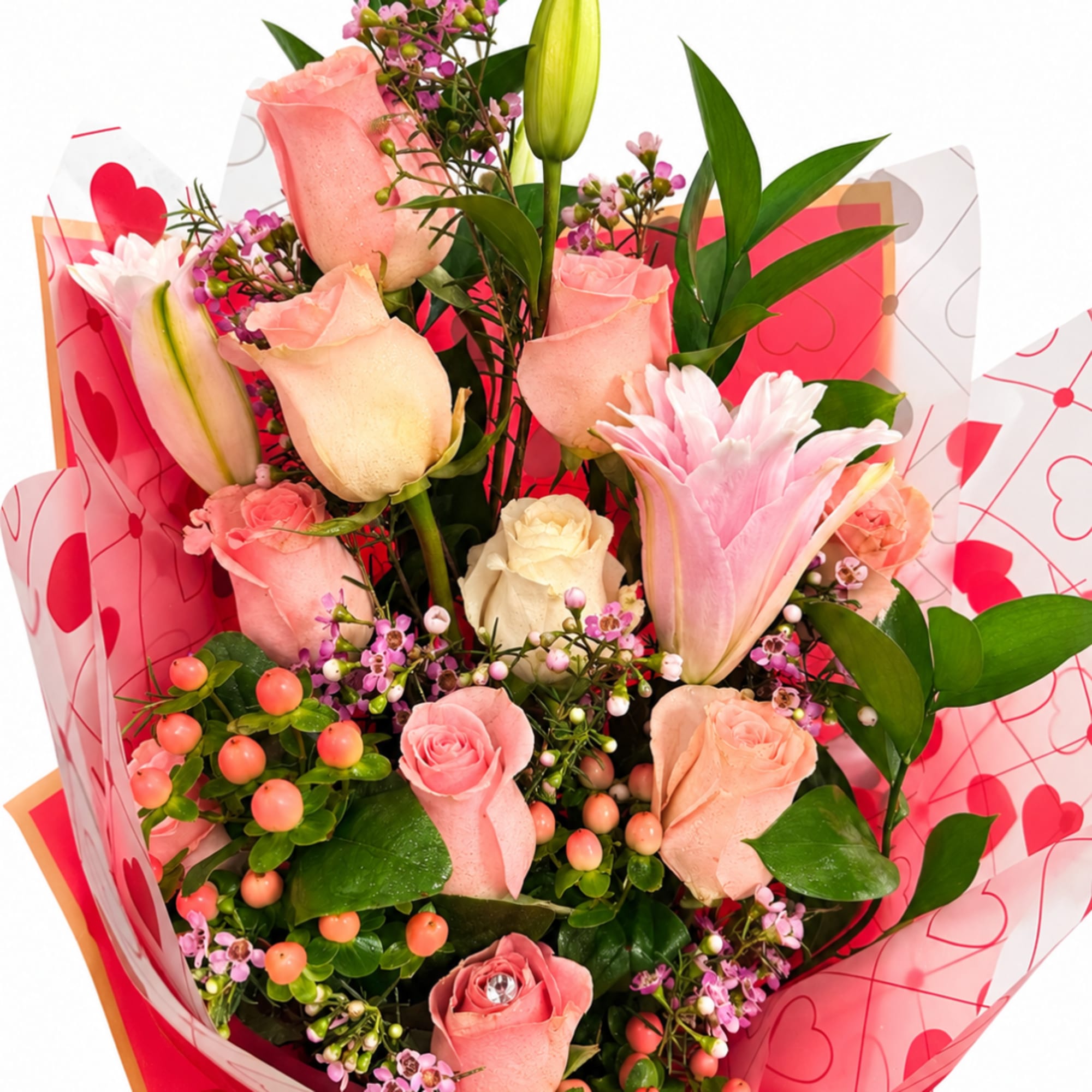 Pink and peach roses with lilies in heart-patterned wrap