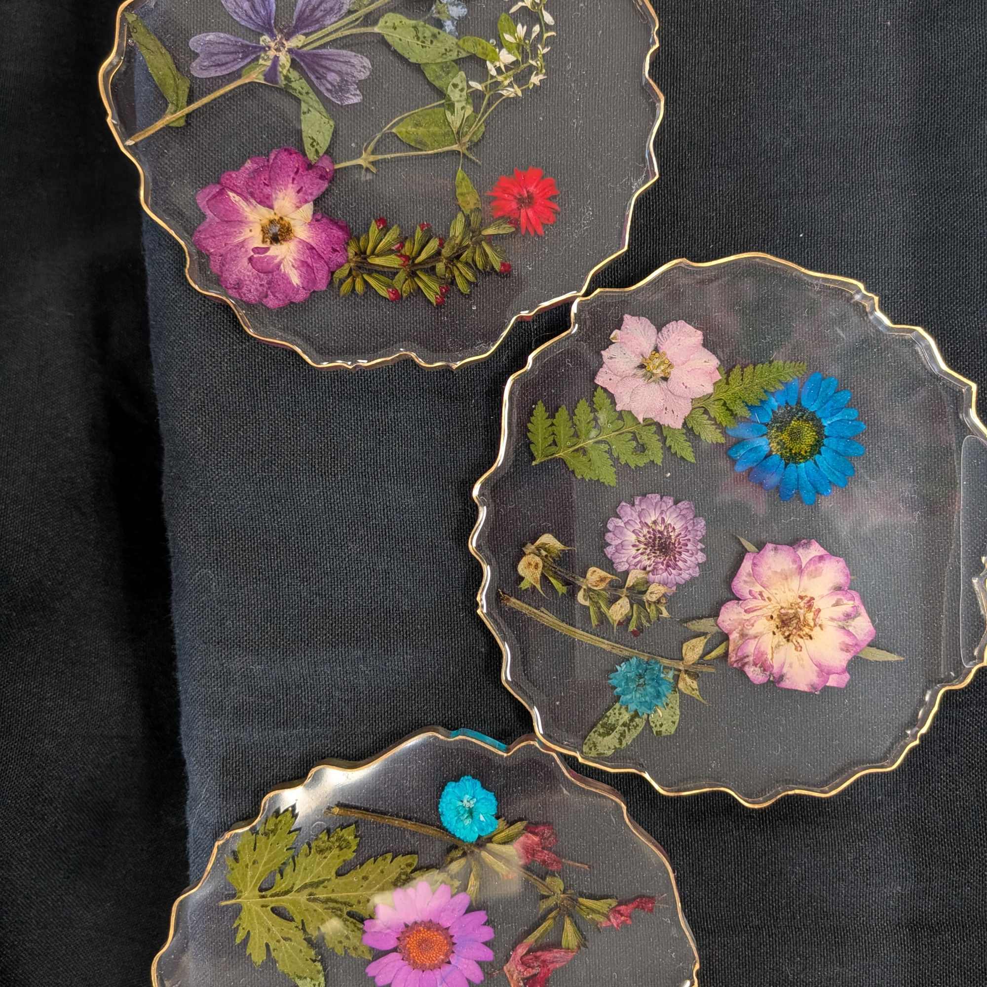 Resin coasters with dried flowers. 