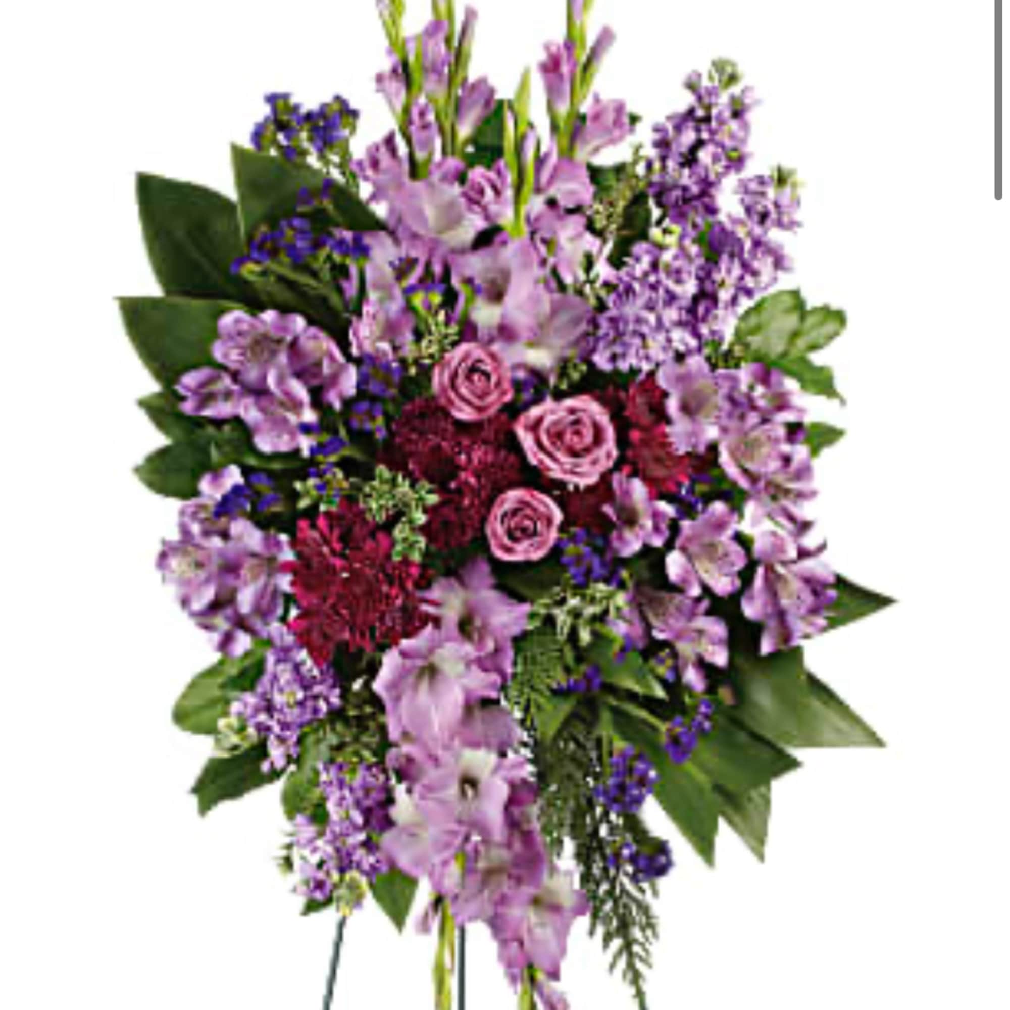 Standing floral spray with pink roses and purple flowers