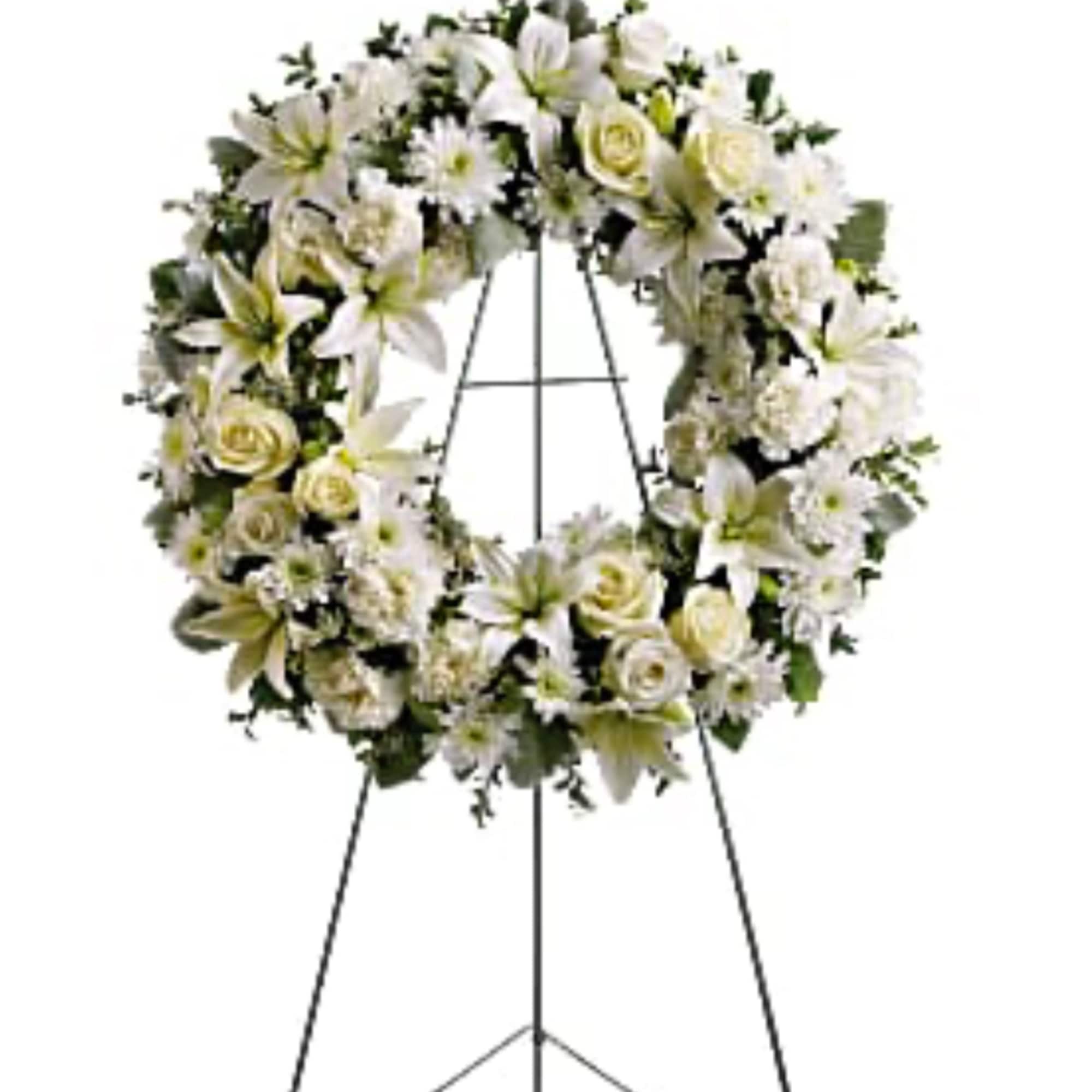 White floral wreath on a standing easel