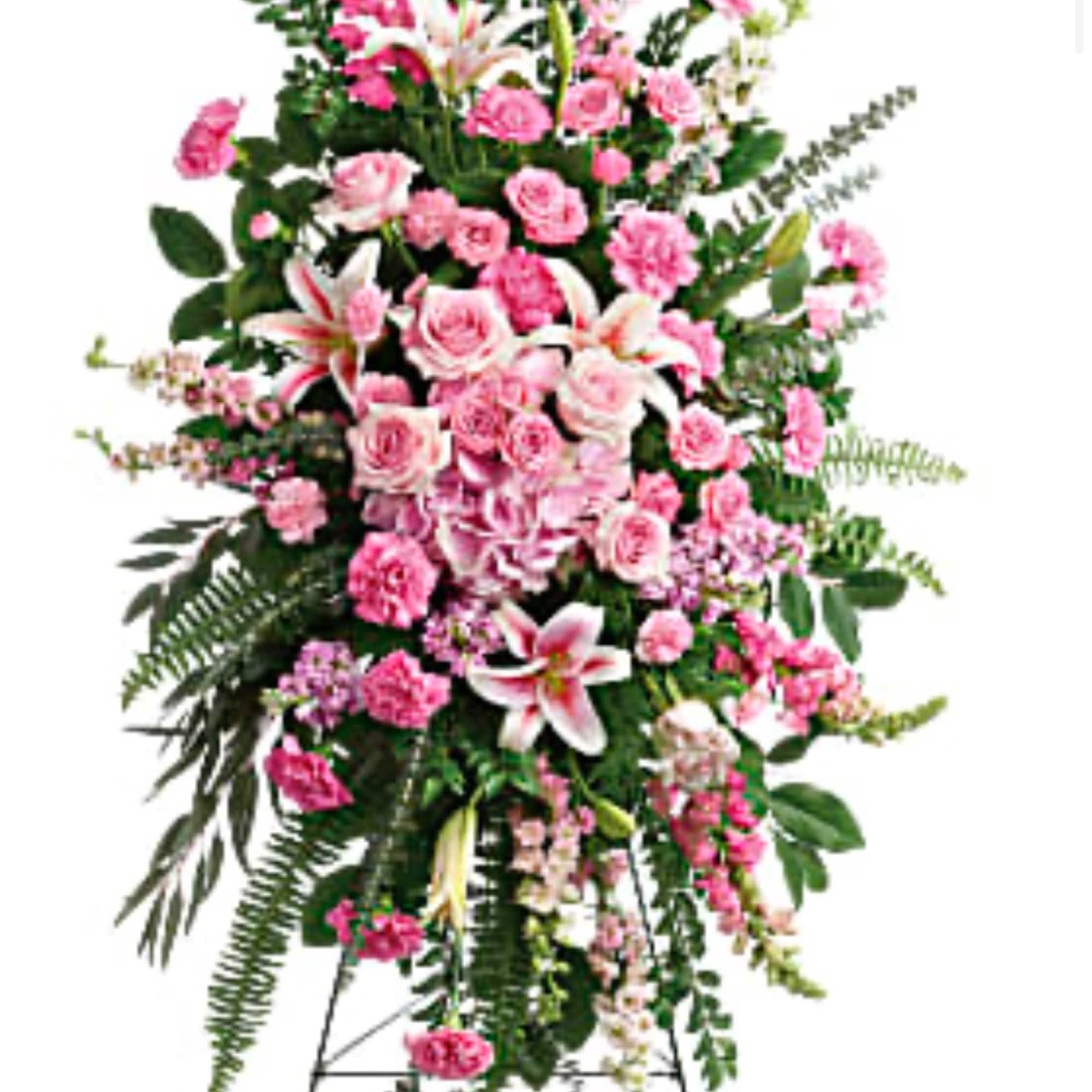 Tall pink floral standing spray on an easel