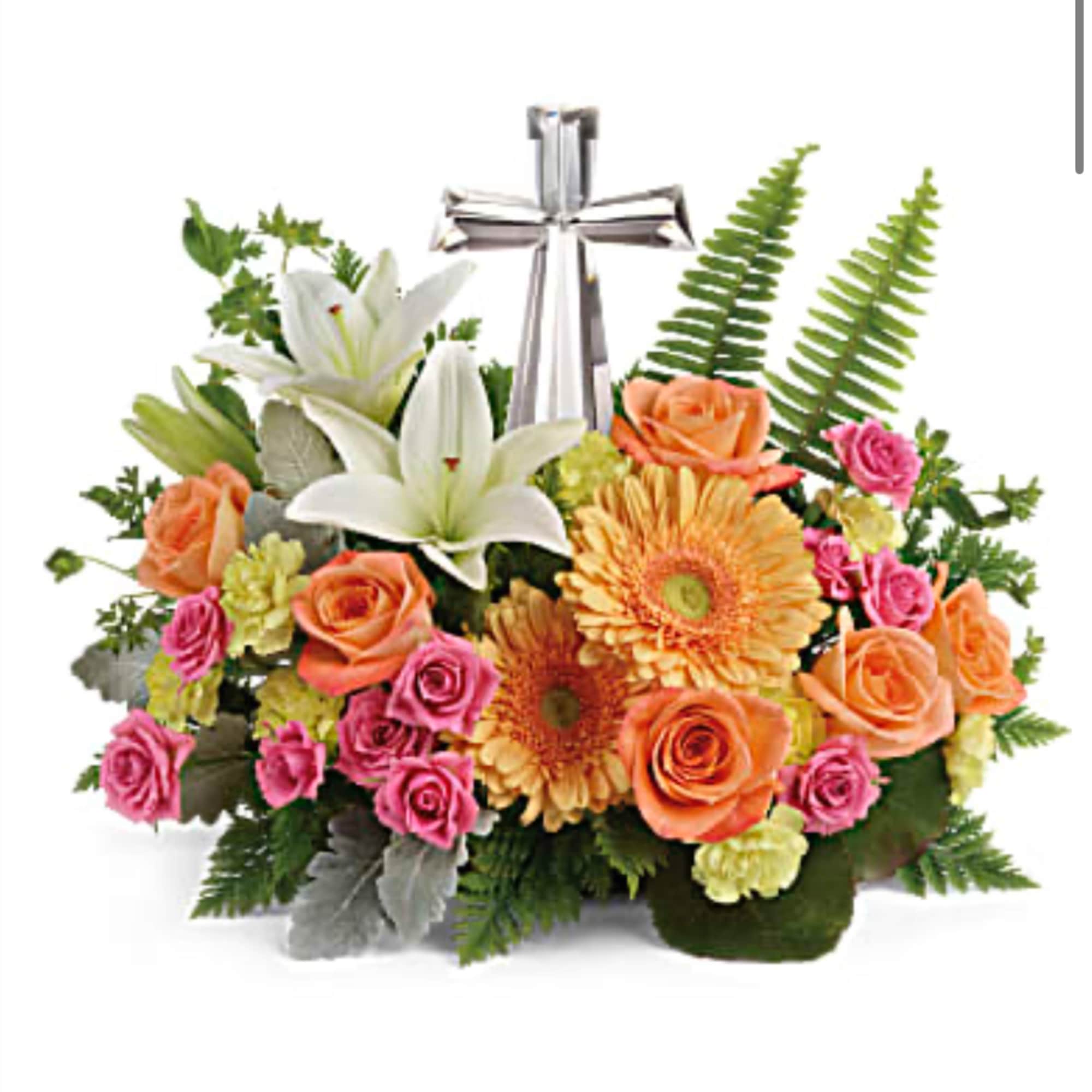 Mixed bouquet with lilies, roses, and gerbera daisies in a silver vase
