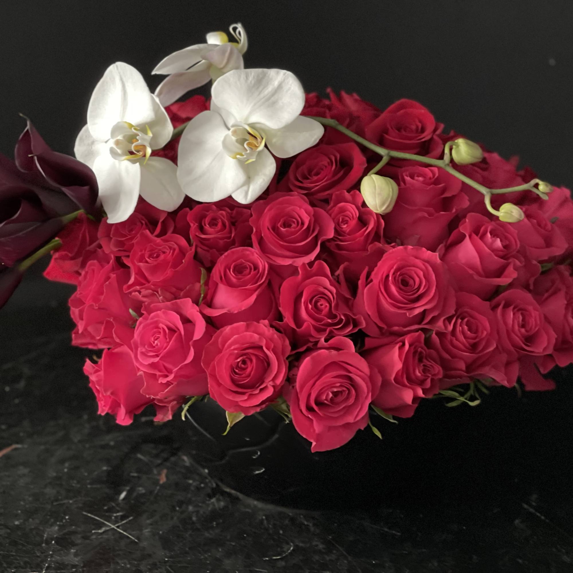 Bouquet of hot pink roses with white orchids and dark calla lilies, photo 6 of 10