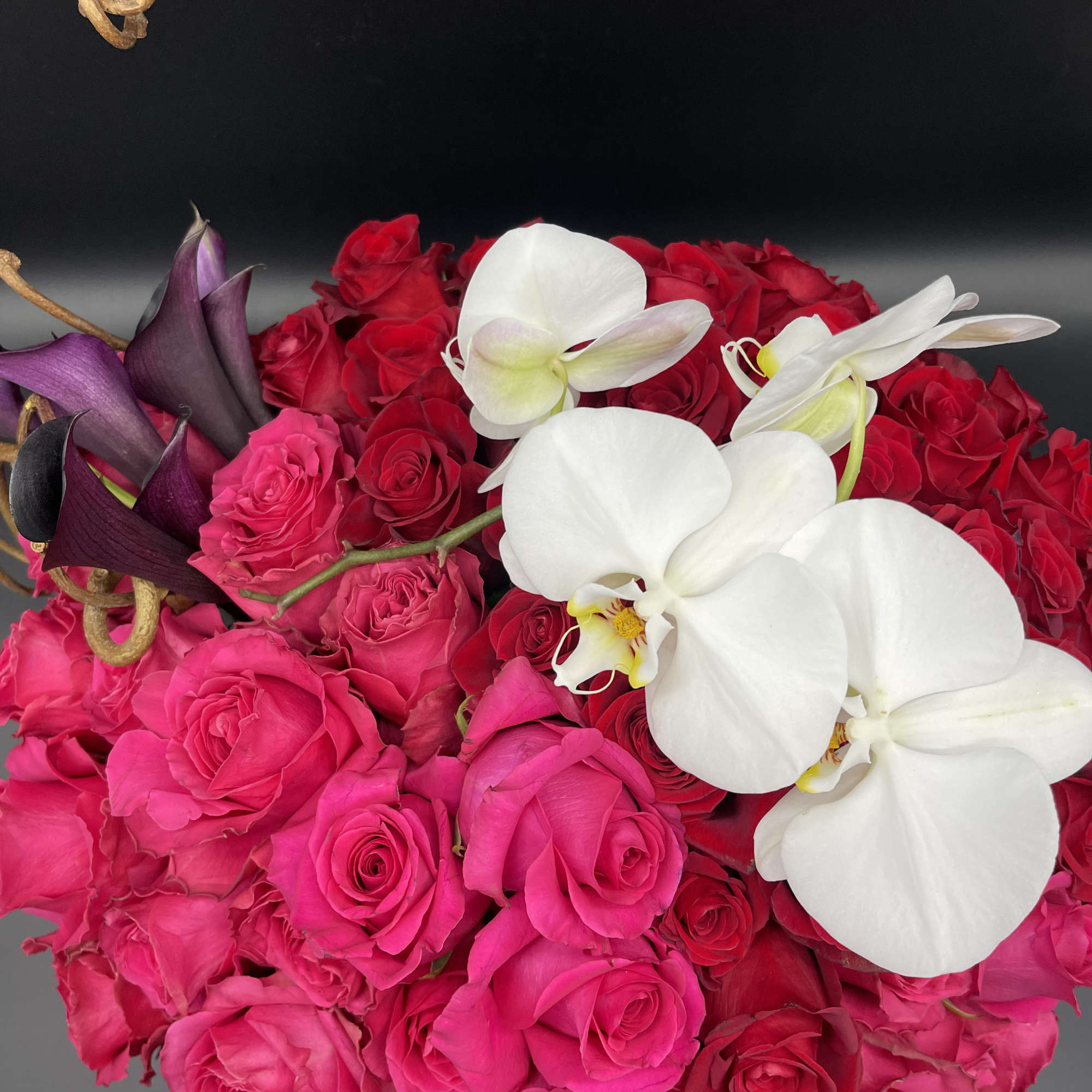 60 Red roses with one orchid stem and 10 romantic dark callas, photo 9 of 10