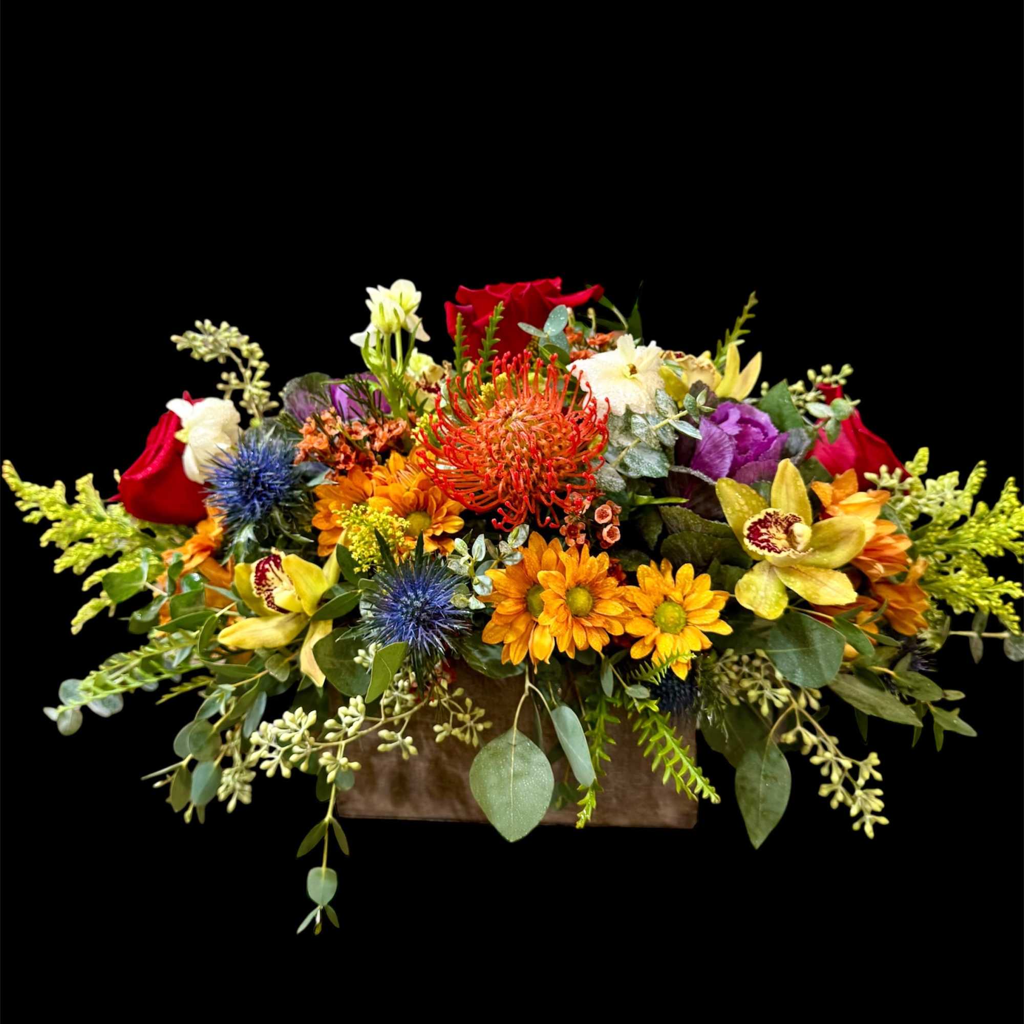 Colorful mixed flower arrangement in a rectangular container
