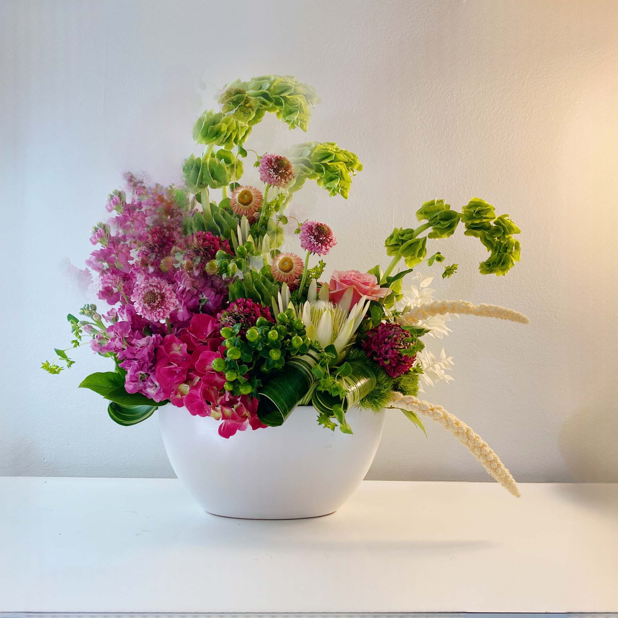 Indulge floral arrangement awaiting your style. This modern marvel in a sleek
