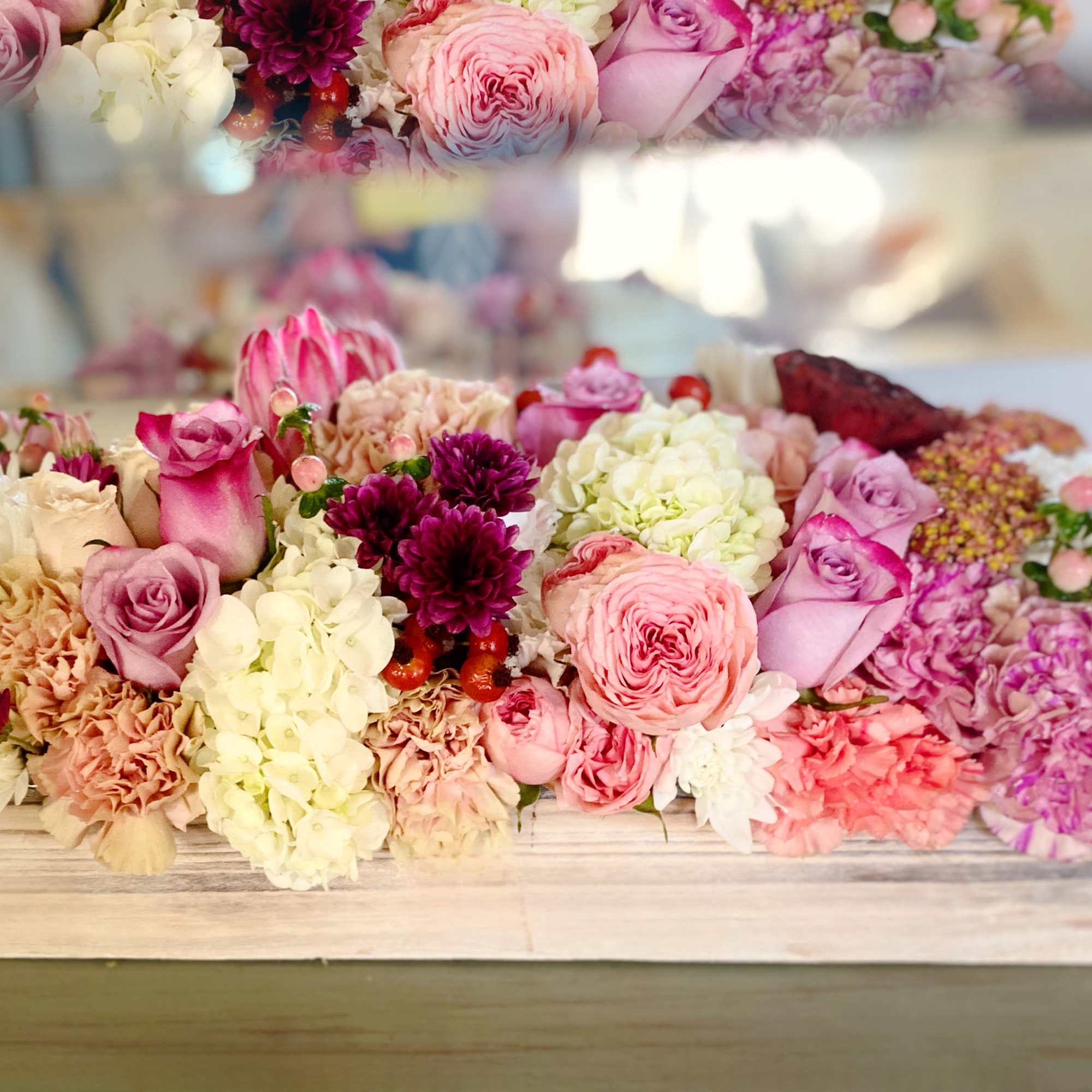 Designed with touches of peach, cream, lavender and red in a keep
