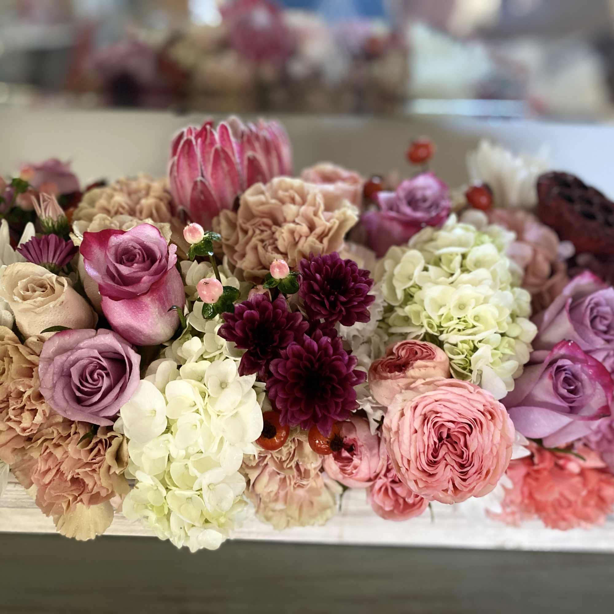 Designed with touches of peach, cream, lavender and red in a keep, photo 2 of 2