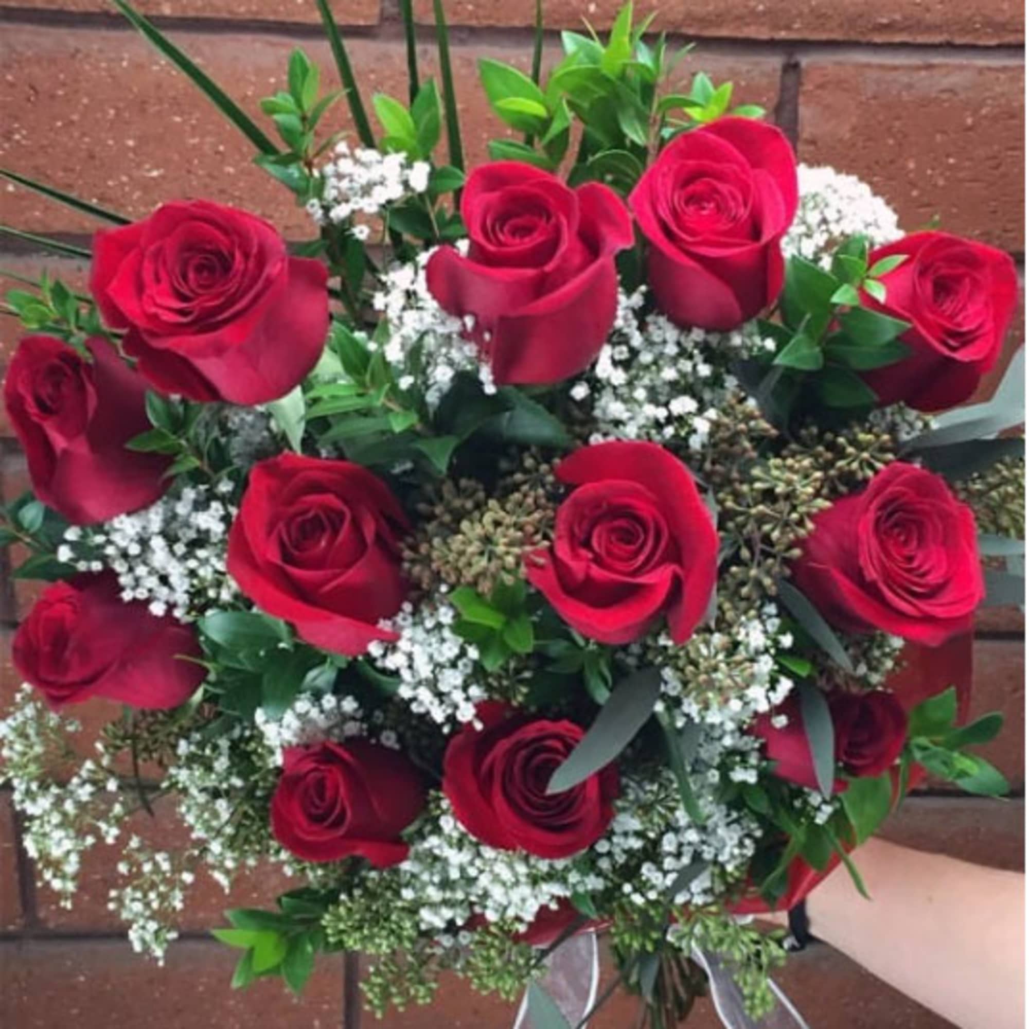 Bouquet of red roses with white baby's breath