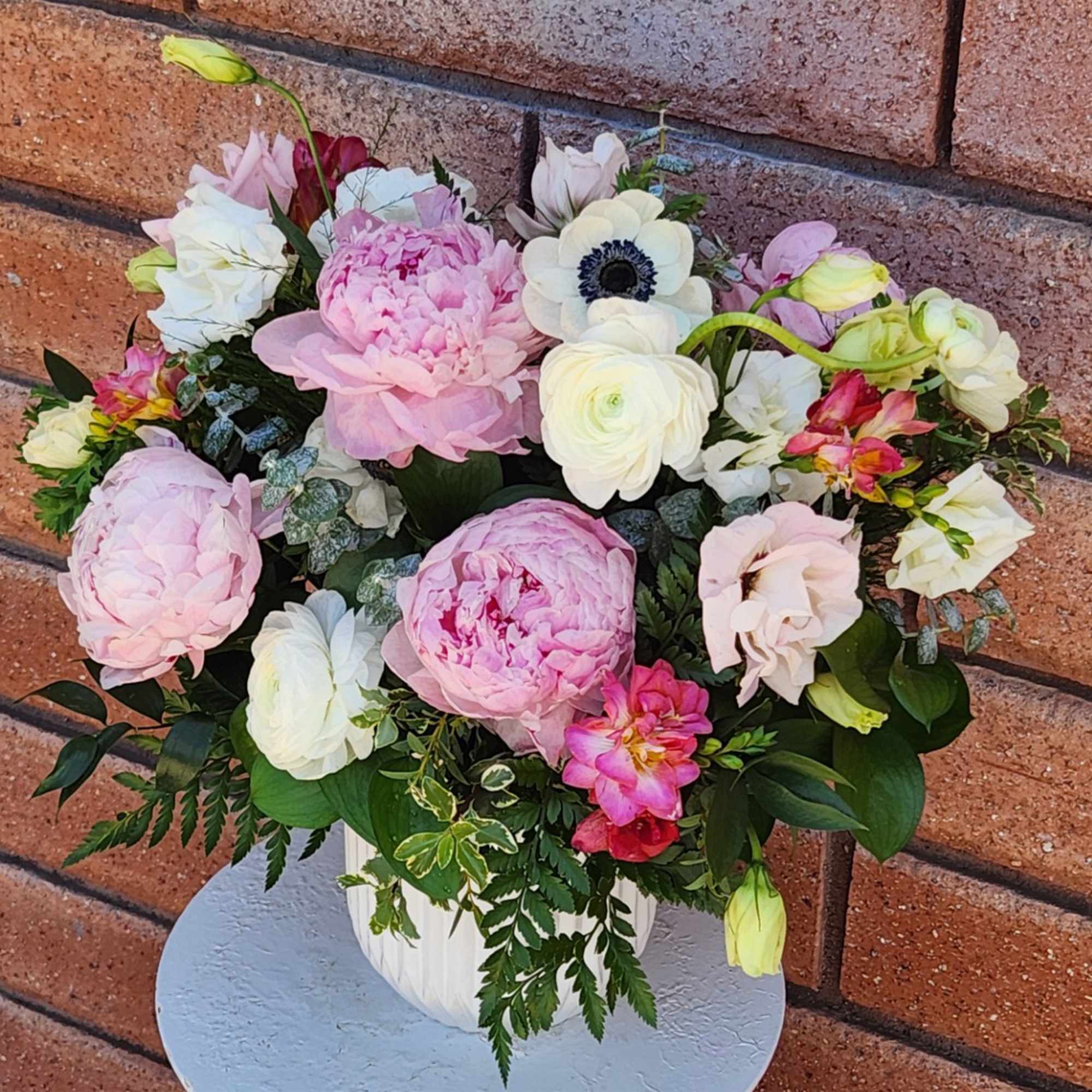 Pink and white mixed flower arrangement in a white vase, photo 4 of 4