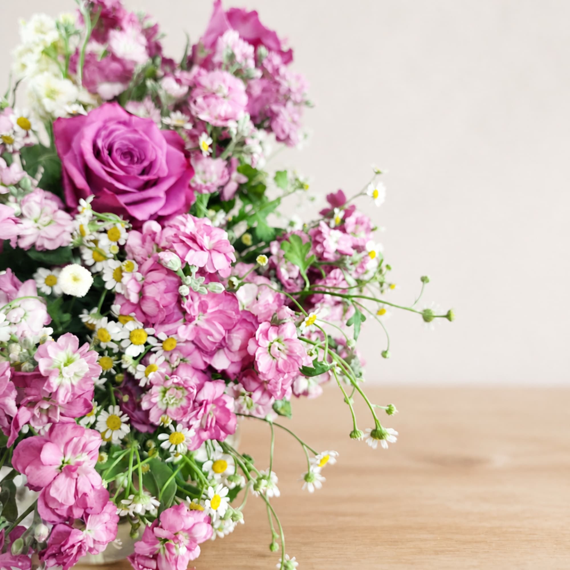 Pink and white mixed flower bouquet with a large purple rose