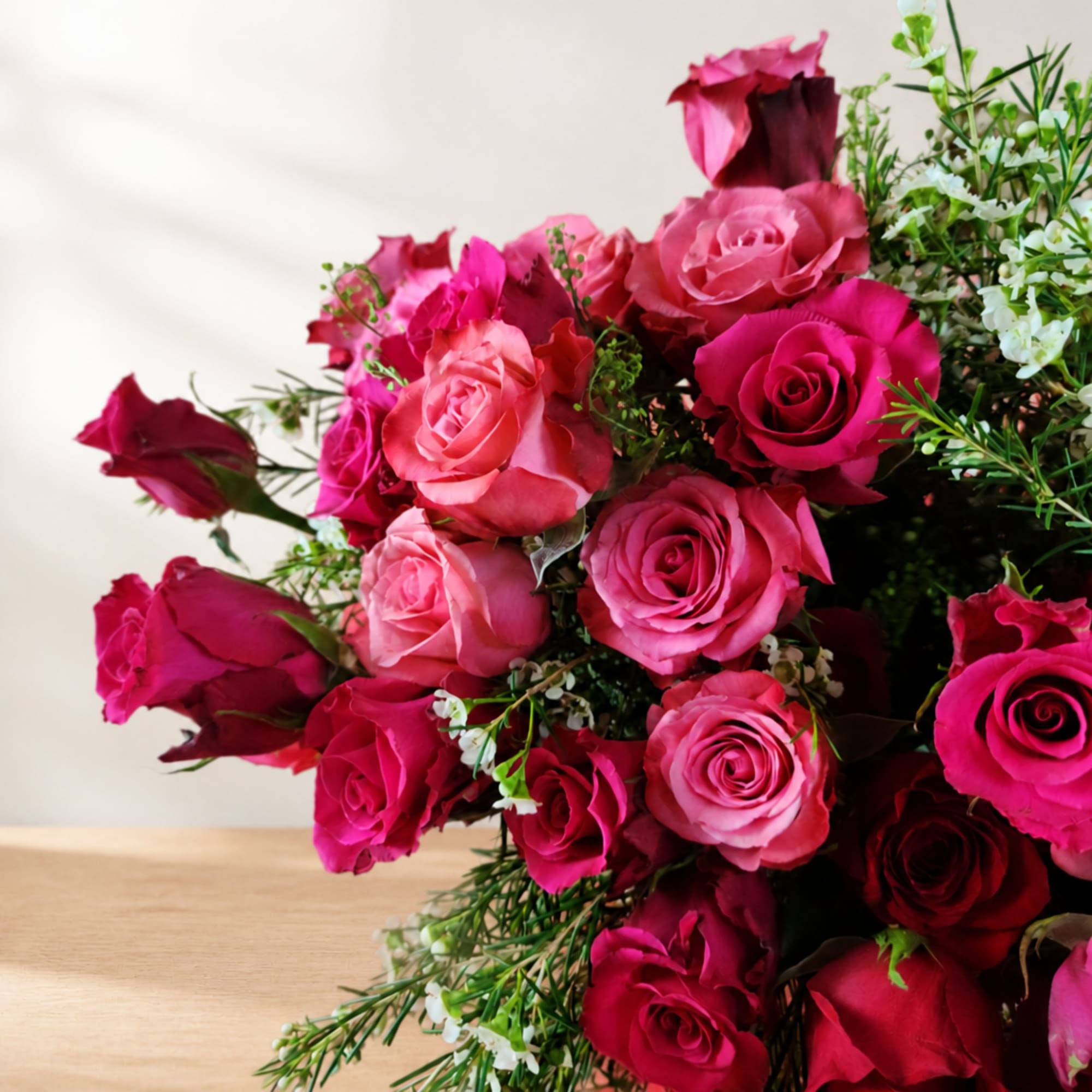 Bouquet of pink and red roses with small white filler flowers, photo 3 of 3