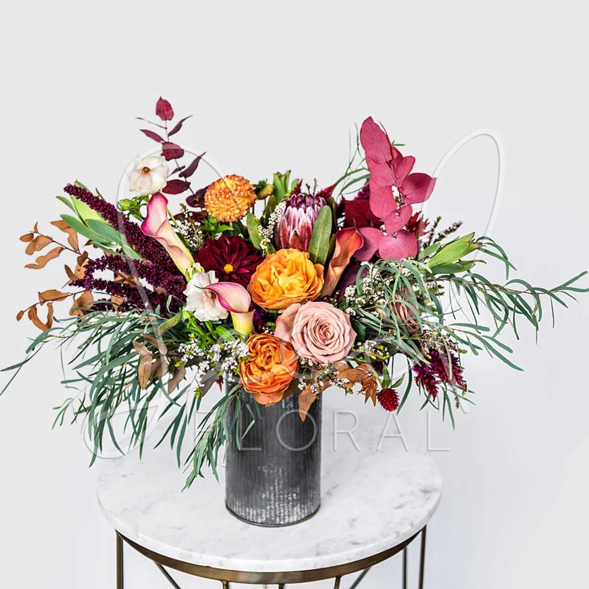 Bring the beauty of fall indoors with this seasonal floral arrangement featuring