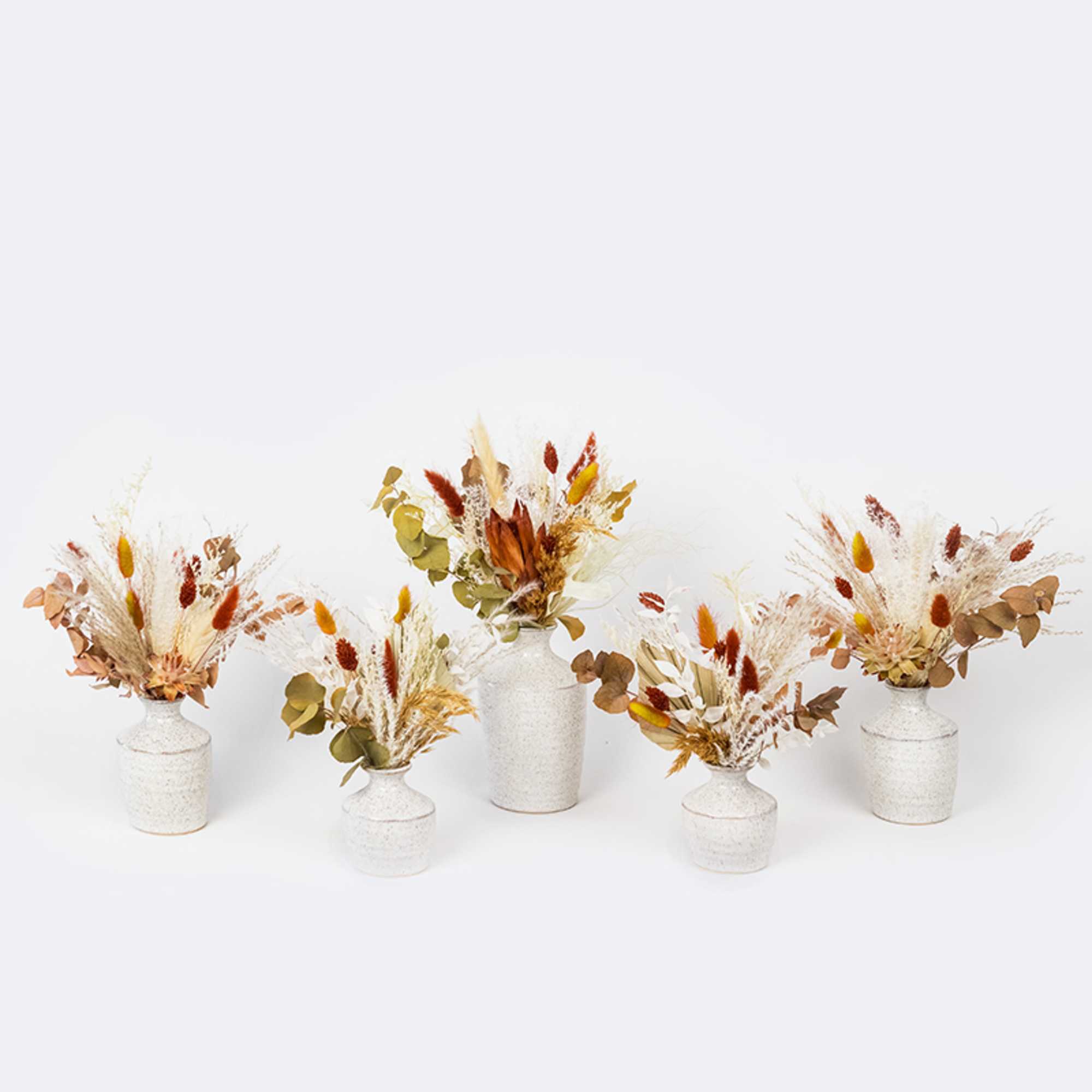 Enjoy this festive set of autumnal preserved blooms arranged in assorted Hari