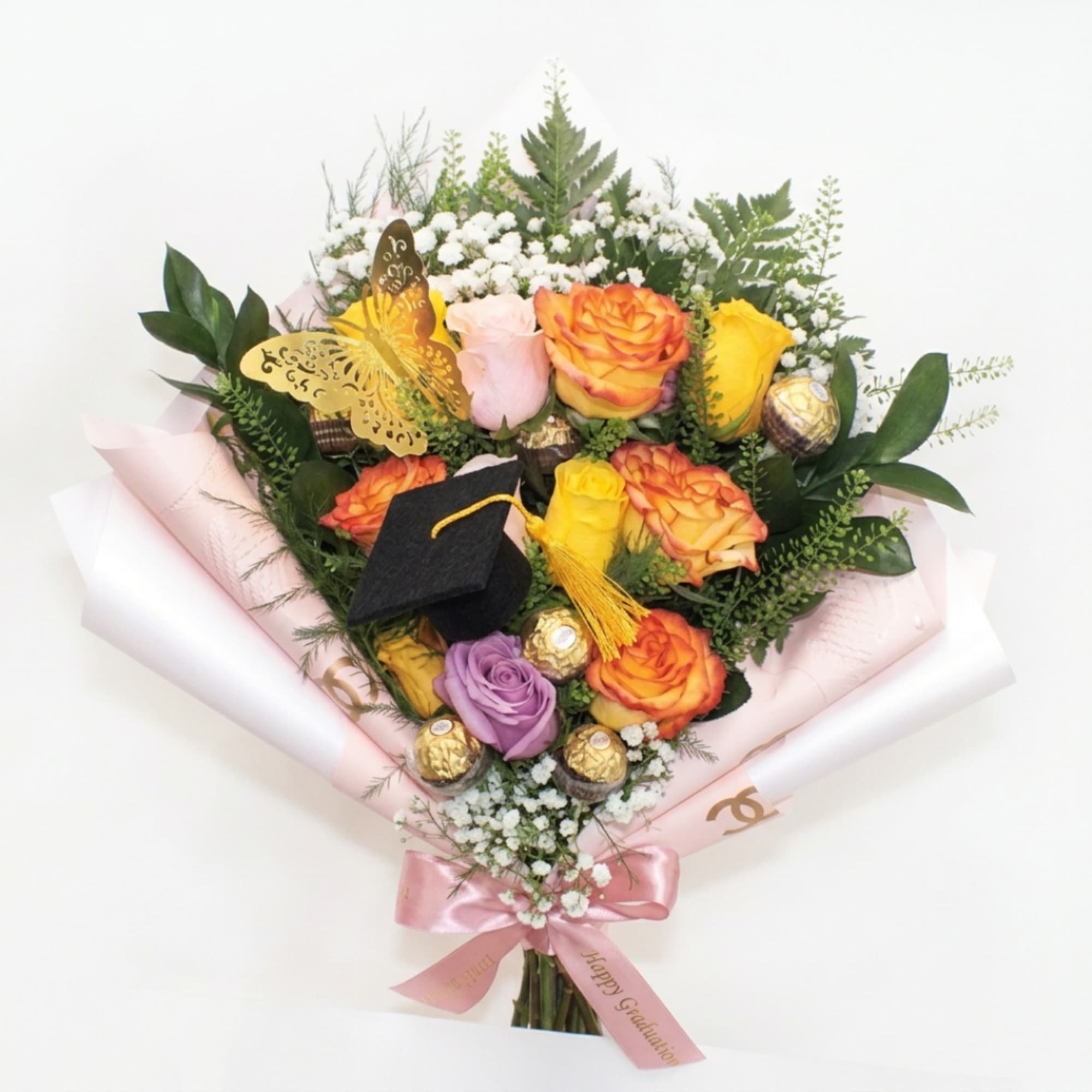 Bouquet of orange, yellow, pink, and purple roses with a graduation cap and chocolates