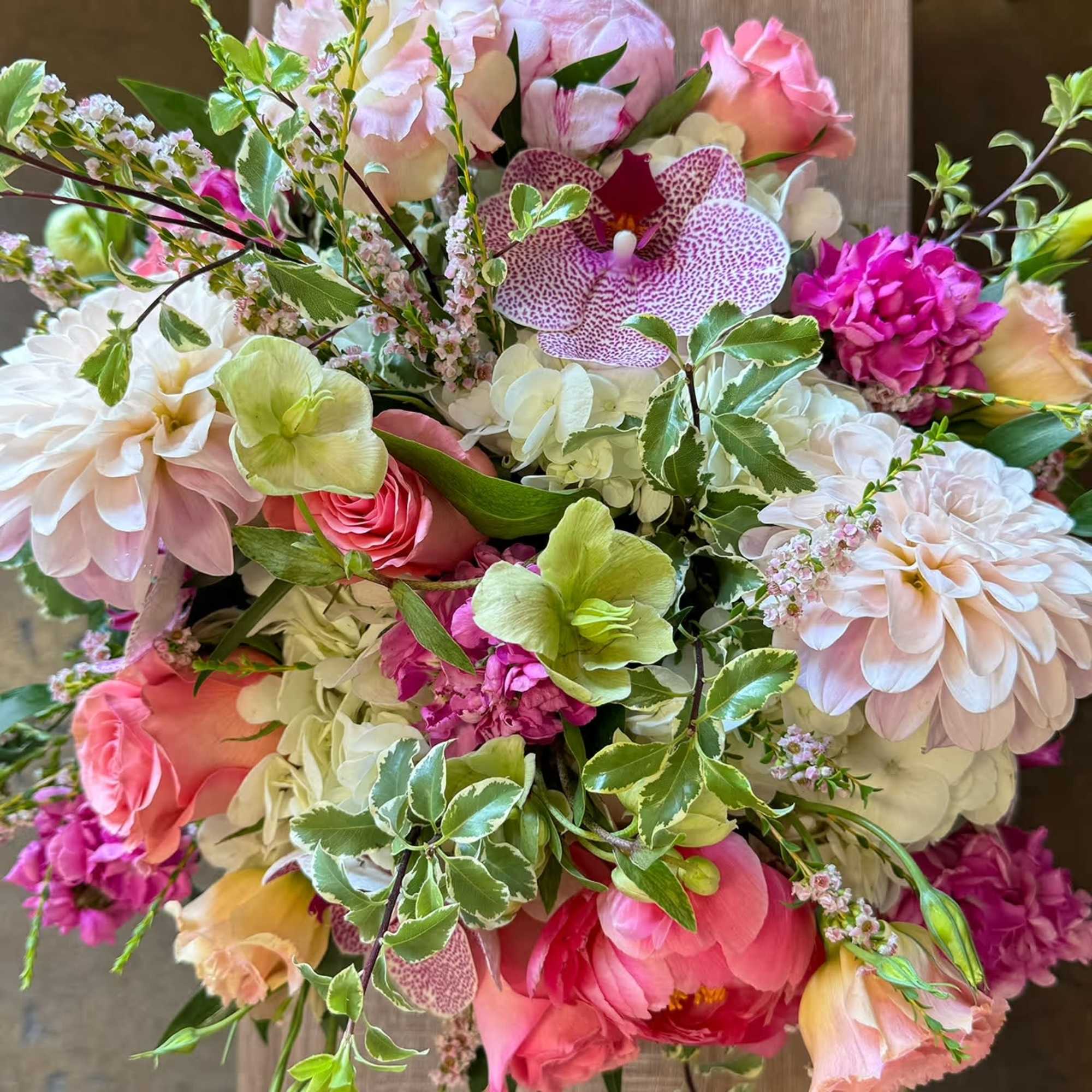 Mixed bouquet with pink, white, and green flowers