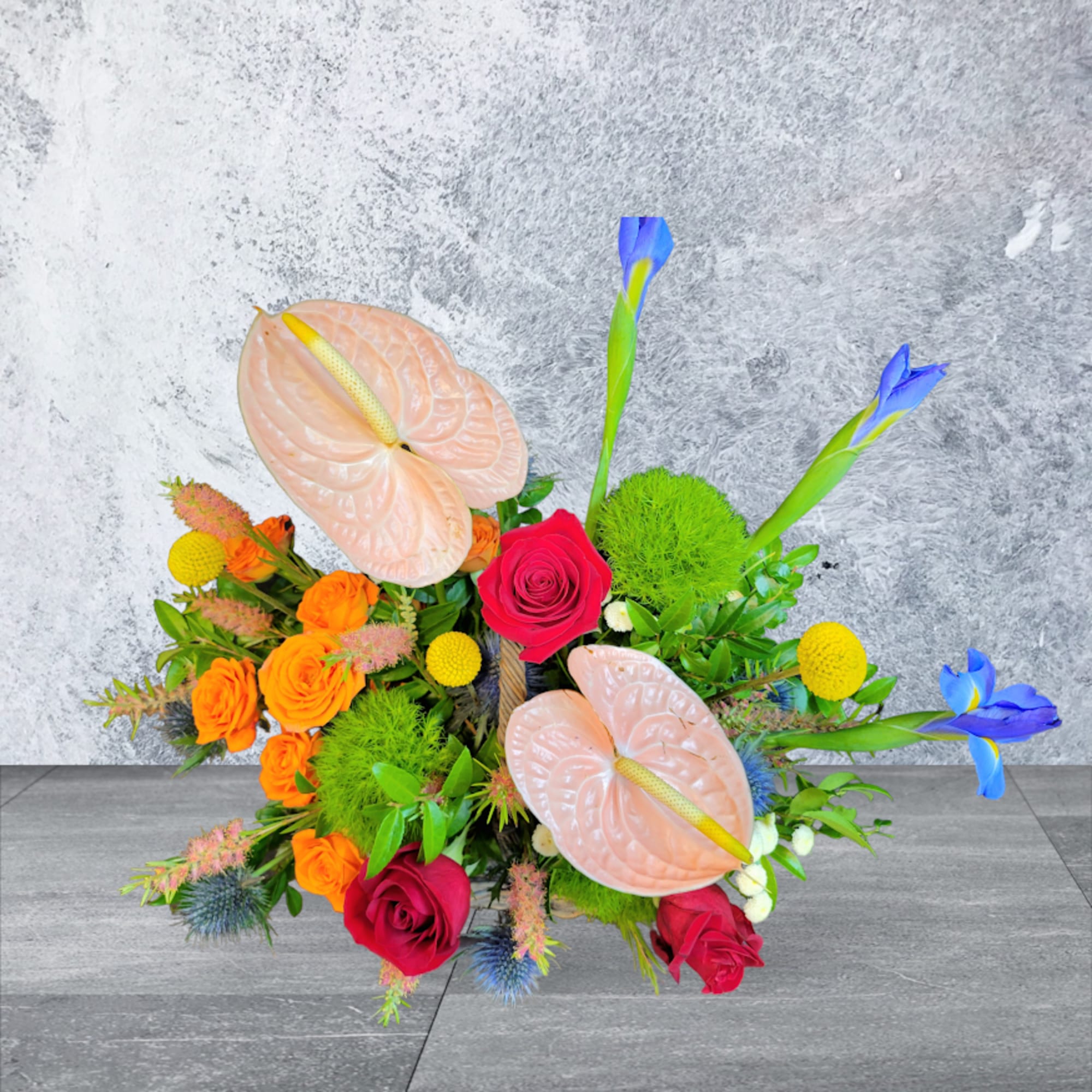 Red Roses, Orange garden roses, Anthurium, Iris arrangements in the Basket
