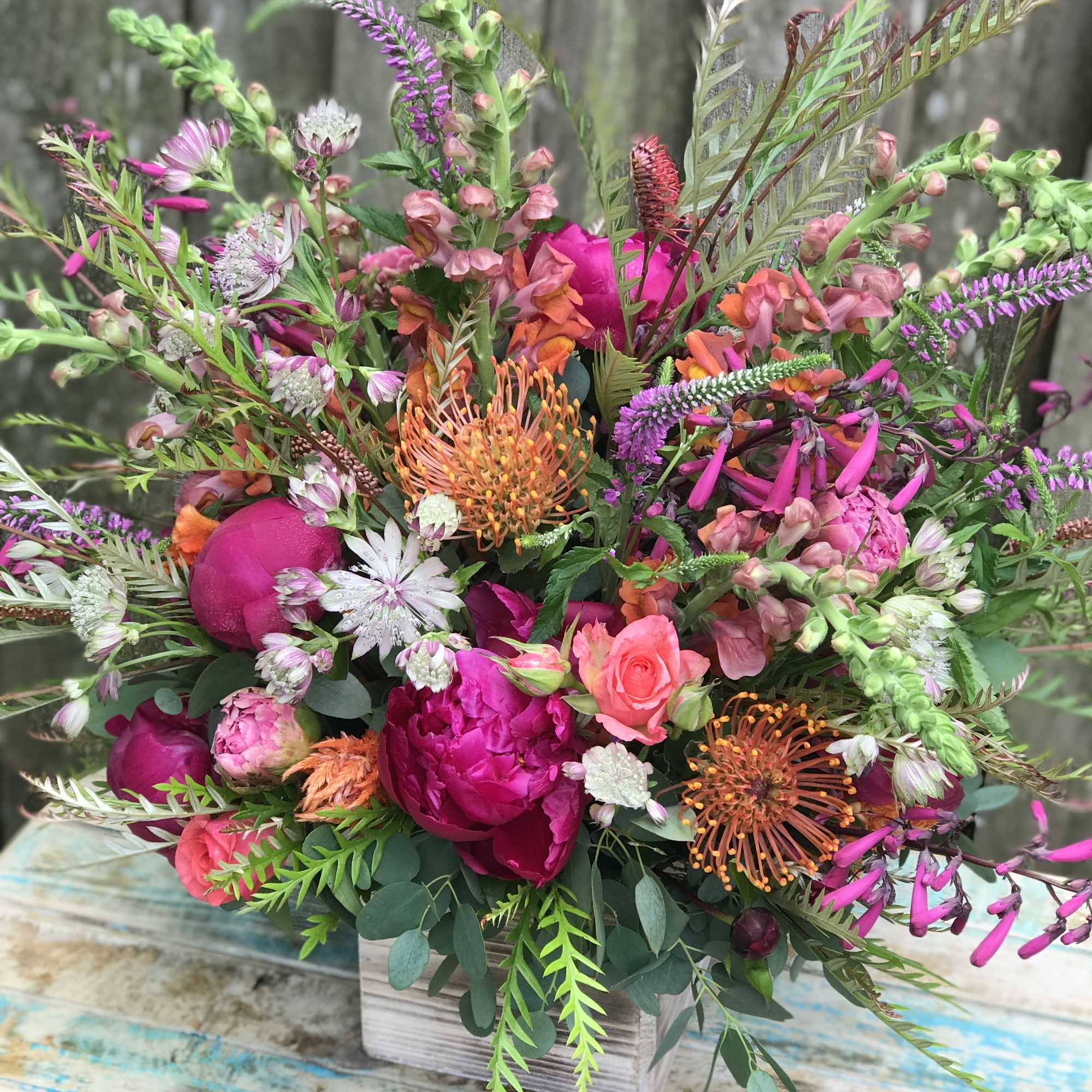 A burst of colorful blooms and textures gathered in an wild garden, photo 2 of 2