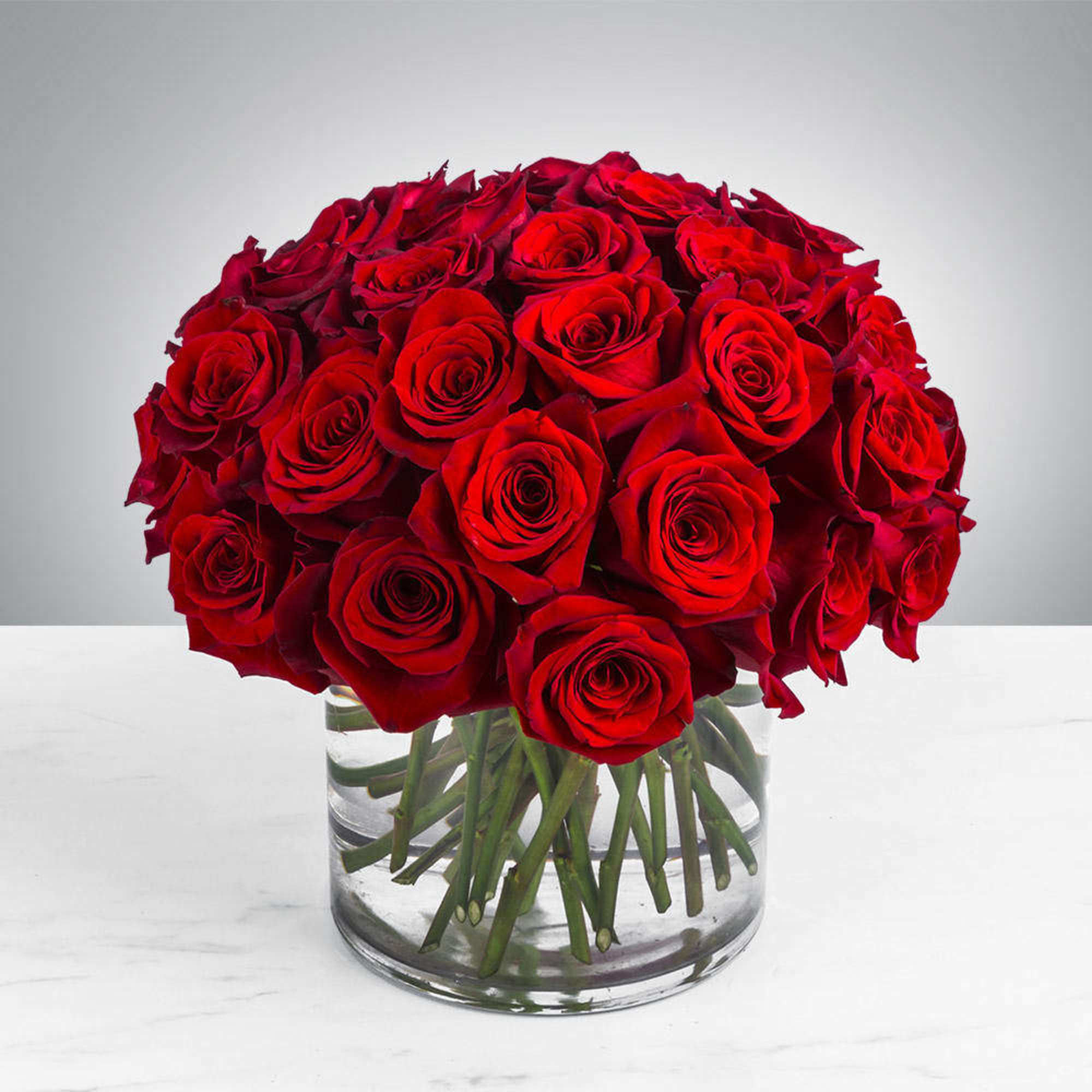 Bouquet of red roses in a clear glass vase