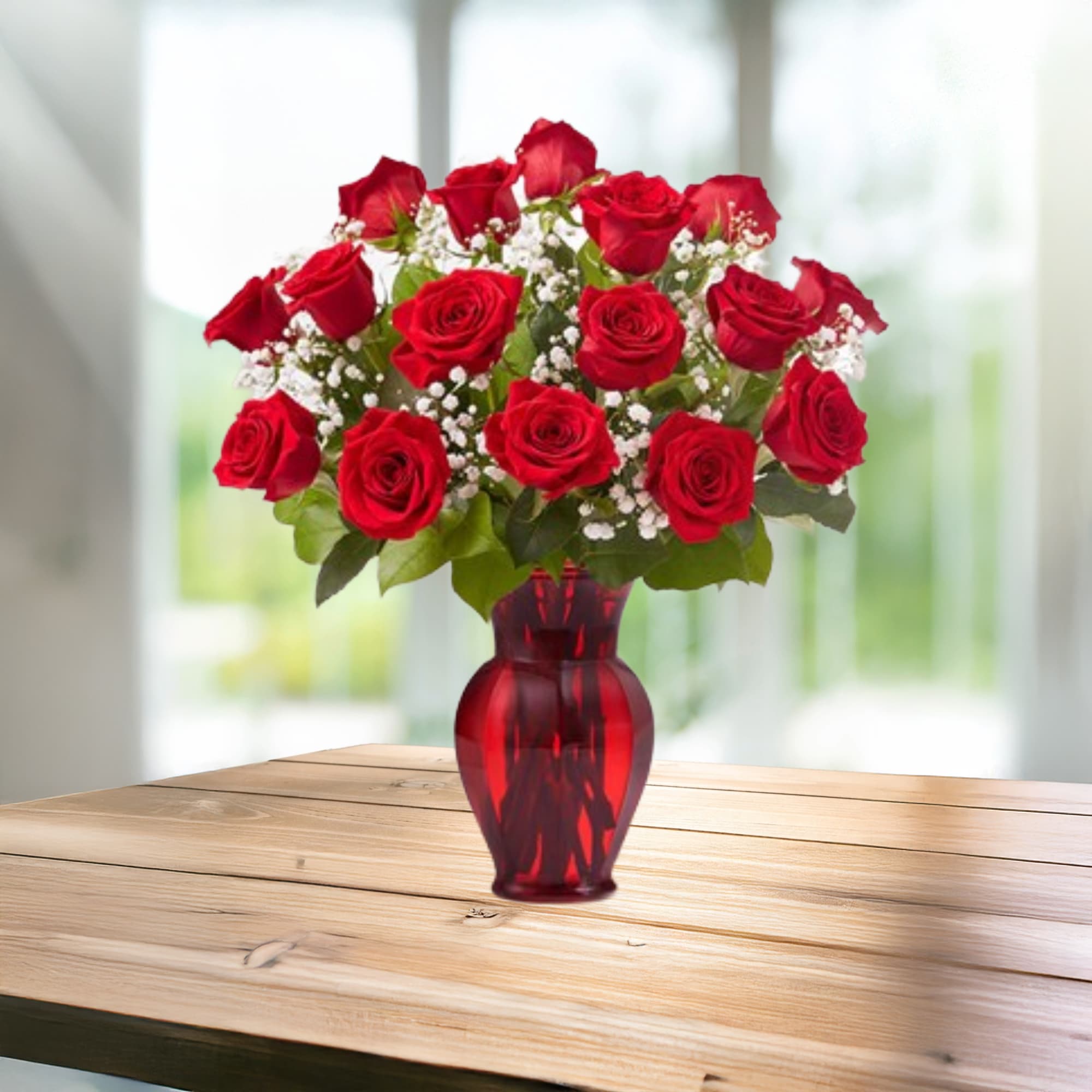 Red roses arranged in a red glass vase