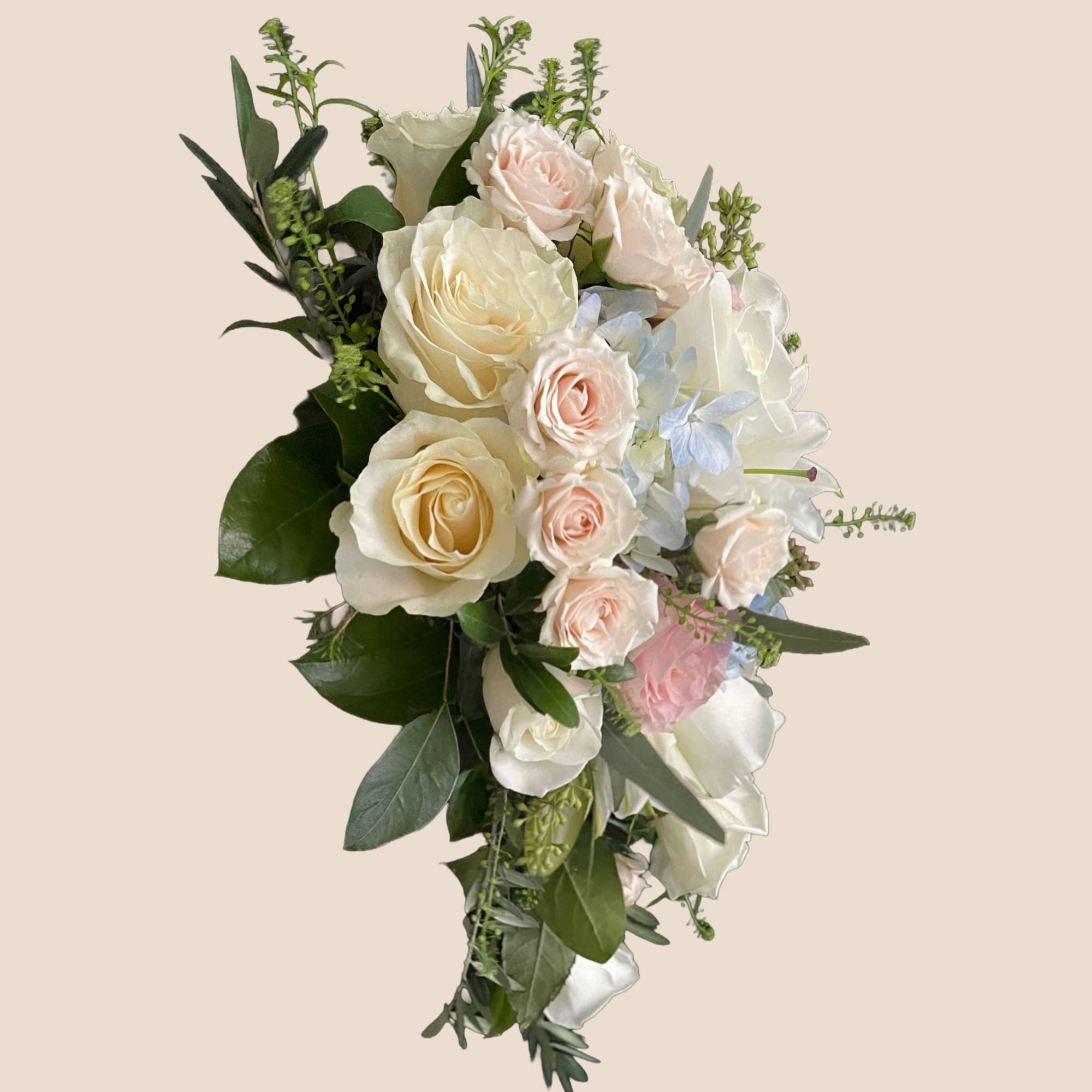Cascade bouquet of white and blush roses with pale blue flowers