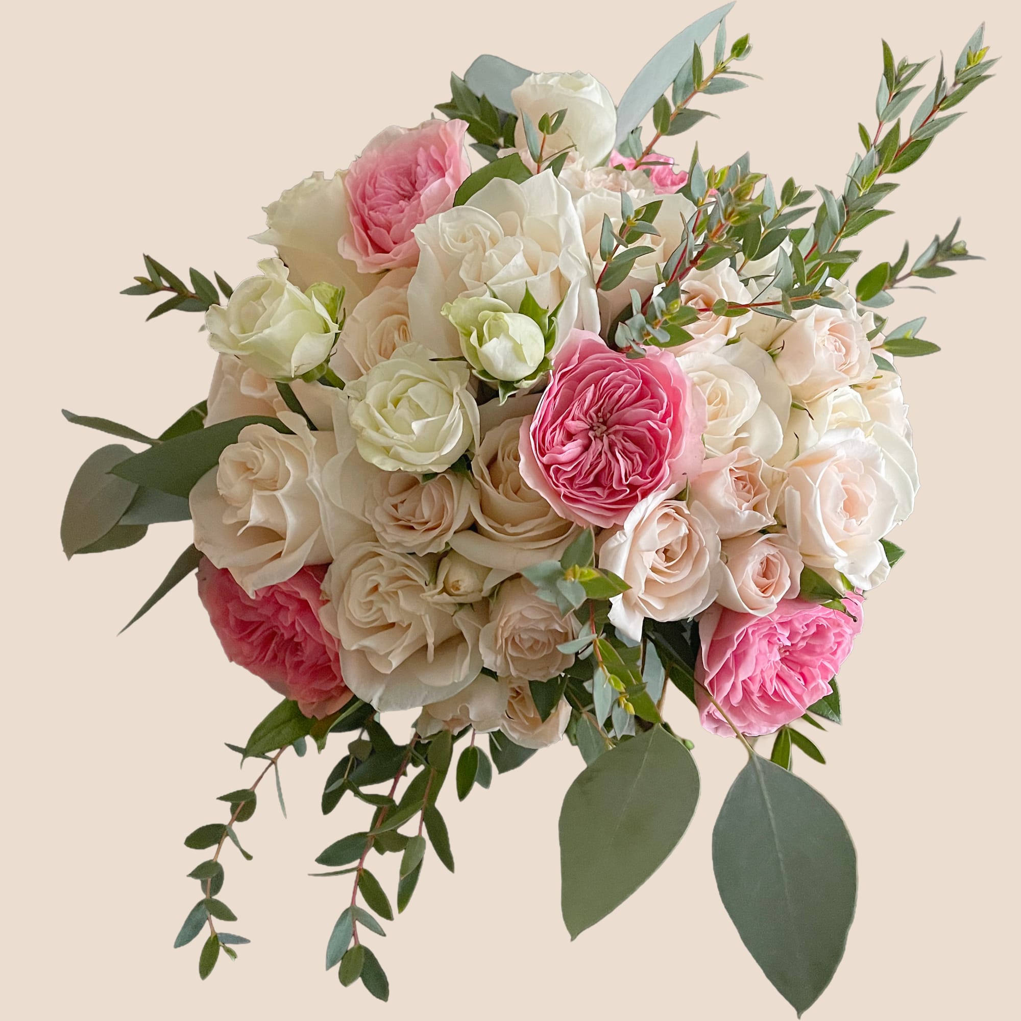 Bouquet of pink and white roses with eucalyptus greenery