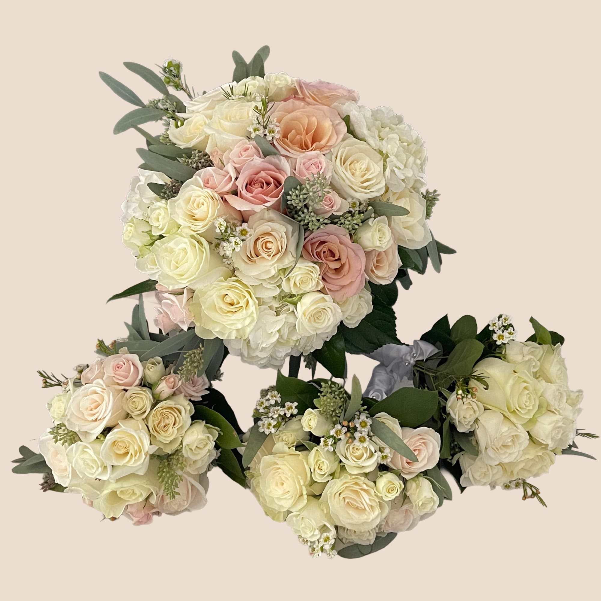 Four pastel rose bouquets with white hydrangeas and eucalyptus