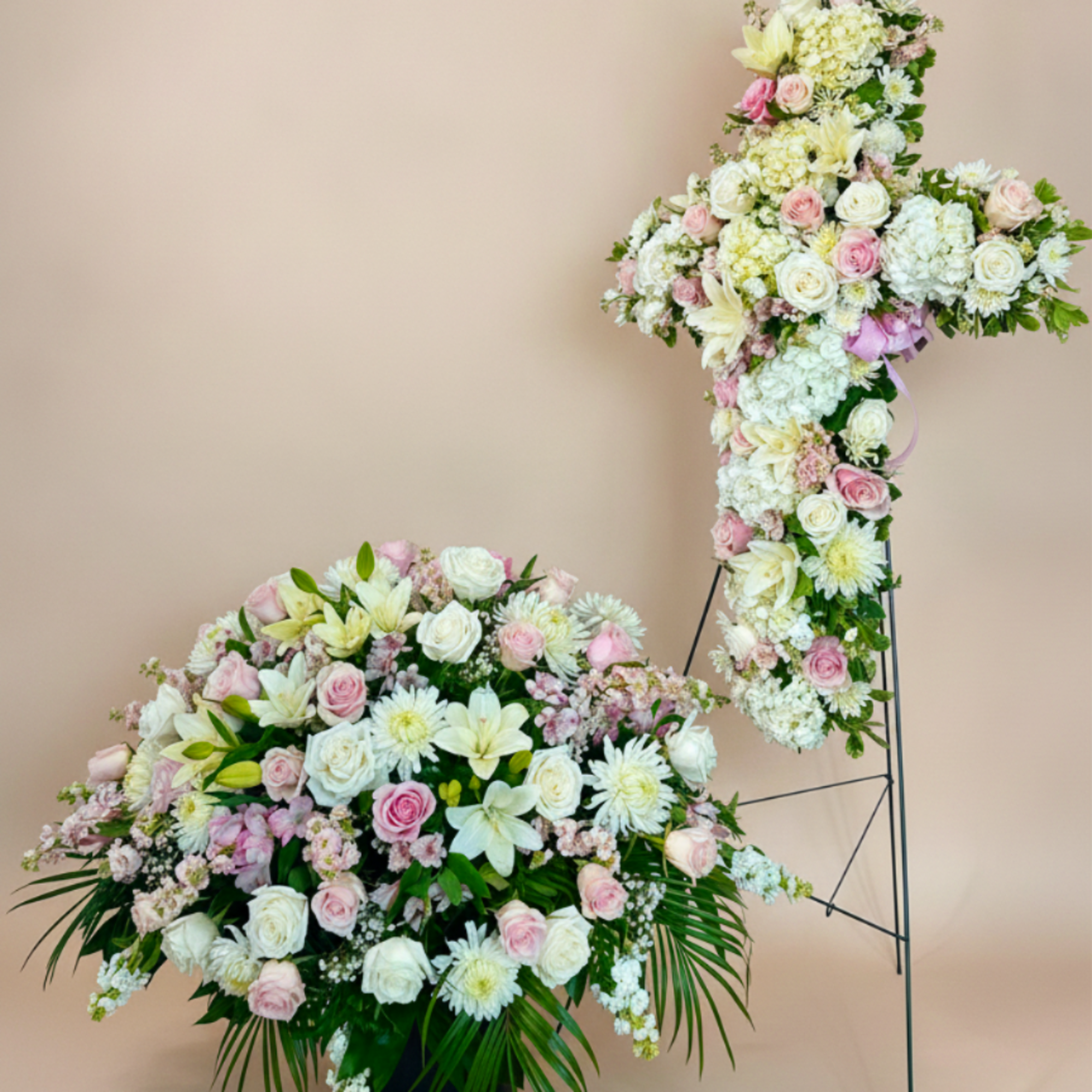 A softly layered casket spray in white, blush pink and pale green, photo 2 of 3