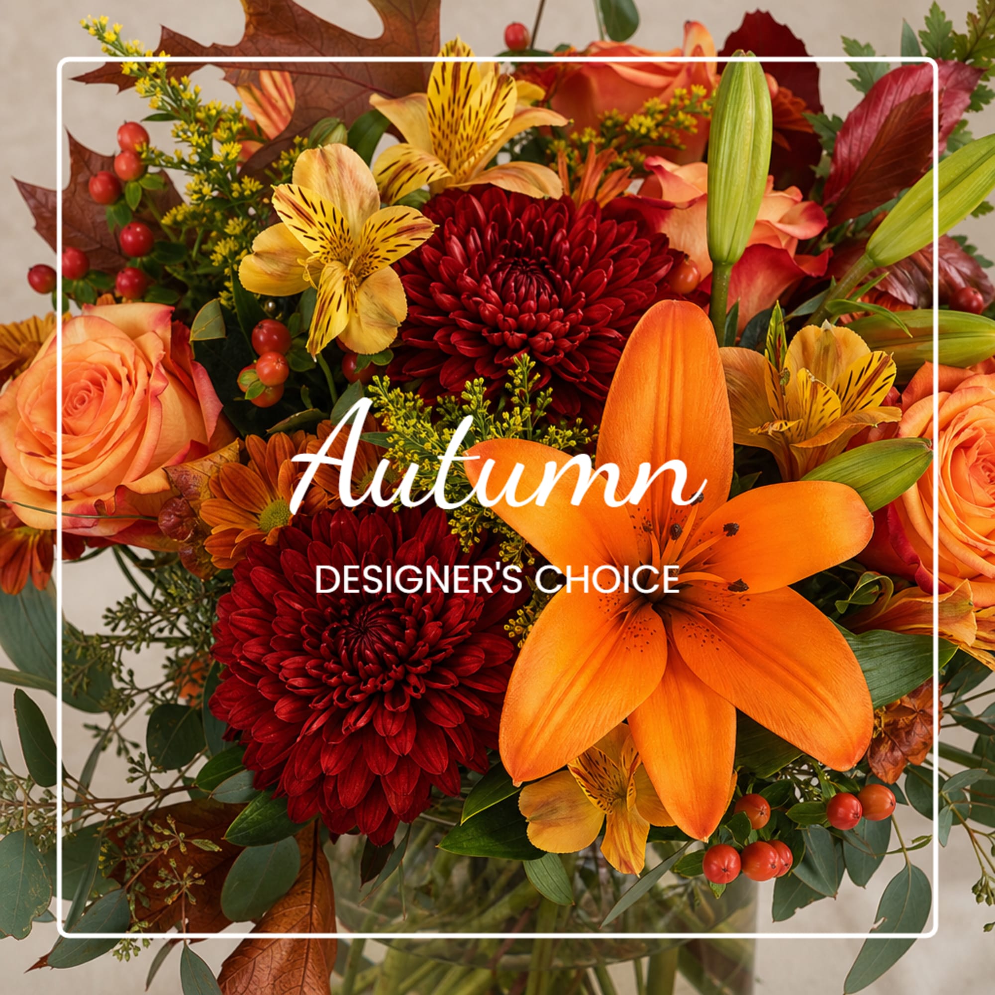 Autumn bouquet with orange roses, red chrysanthemums, and lilies