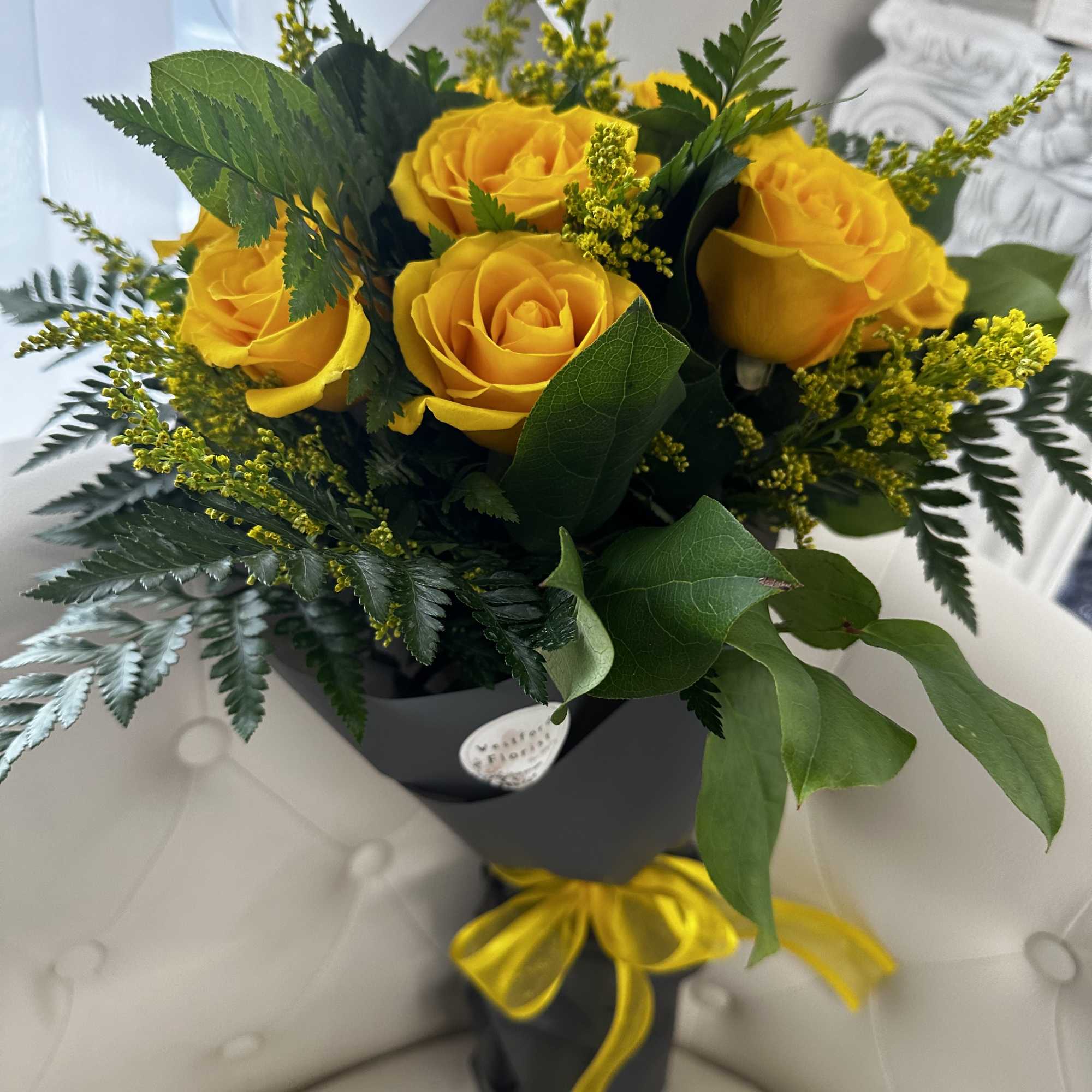 Elevate your gifting experience with the Dozen Yellow Roses Wrapped Bouquet by