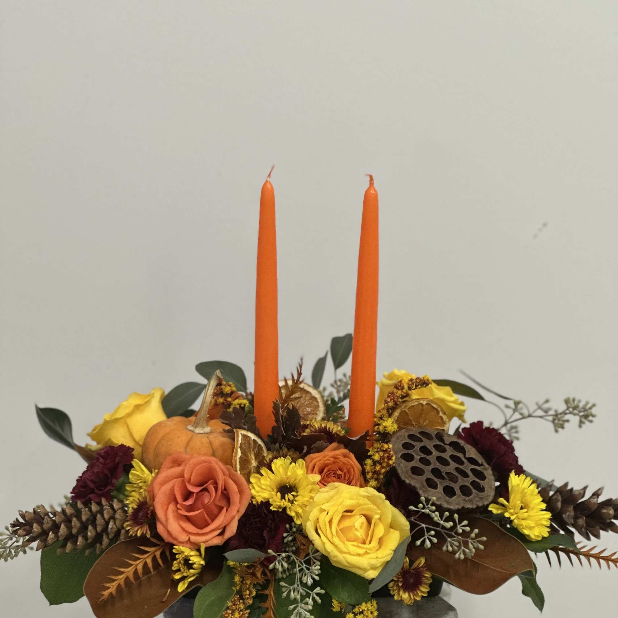 Elevate your holiday festivities with the Harvest Glow Centerpiece from Westford Florist
