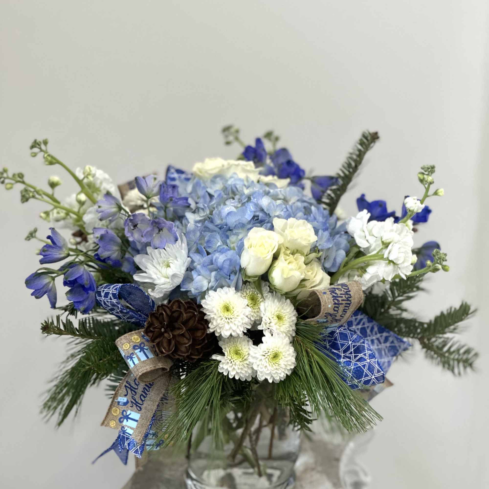Celebrate the magic of Hanukkah with our enchanting arrangement, Hanukkah Harmony by