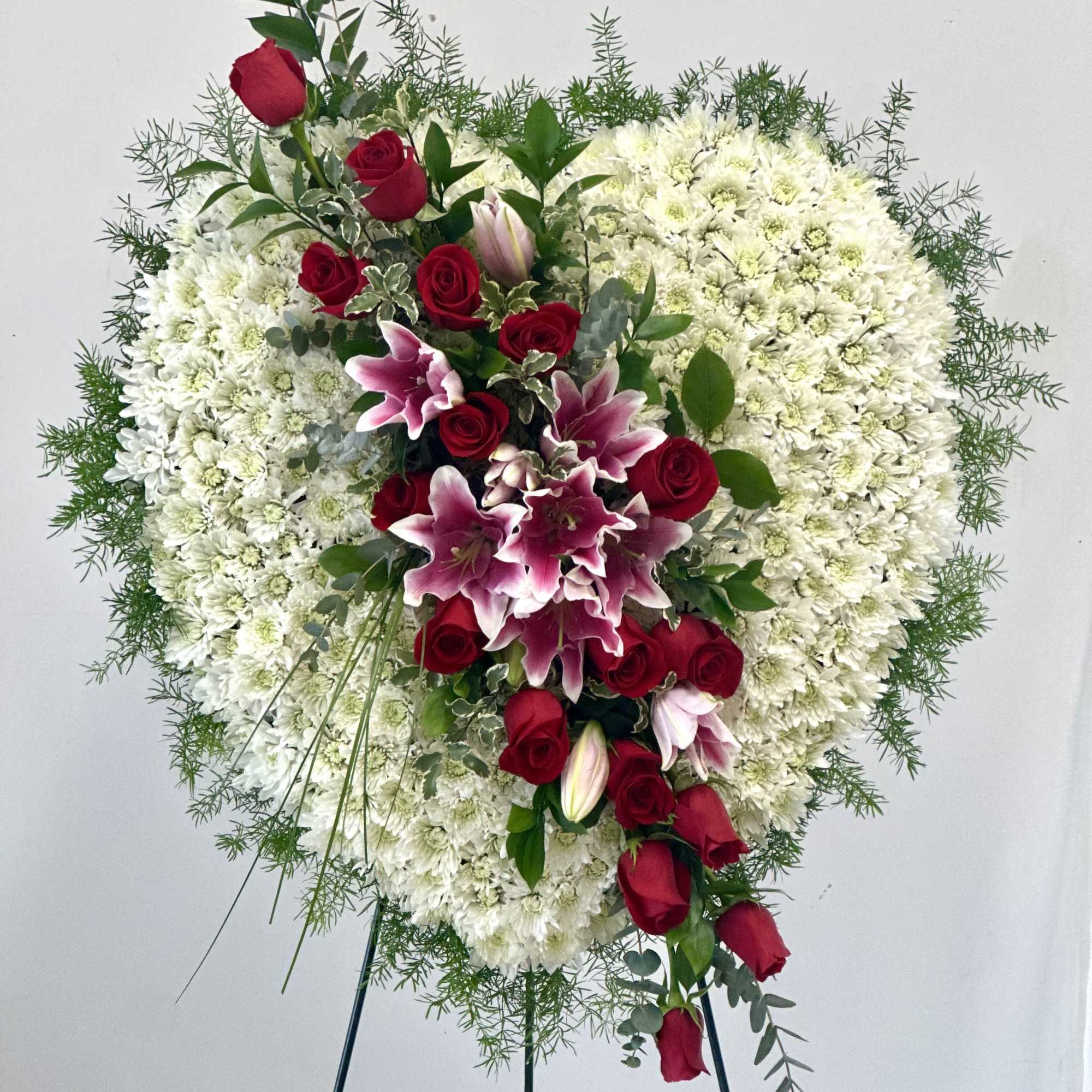 Heart-shaped floral spray with red roses and white chrysanthemums