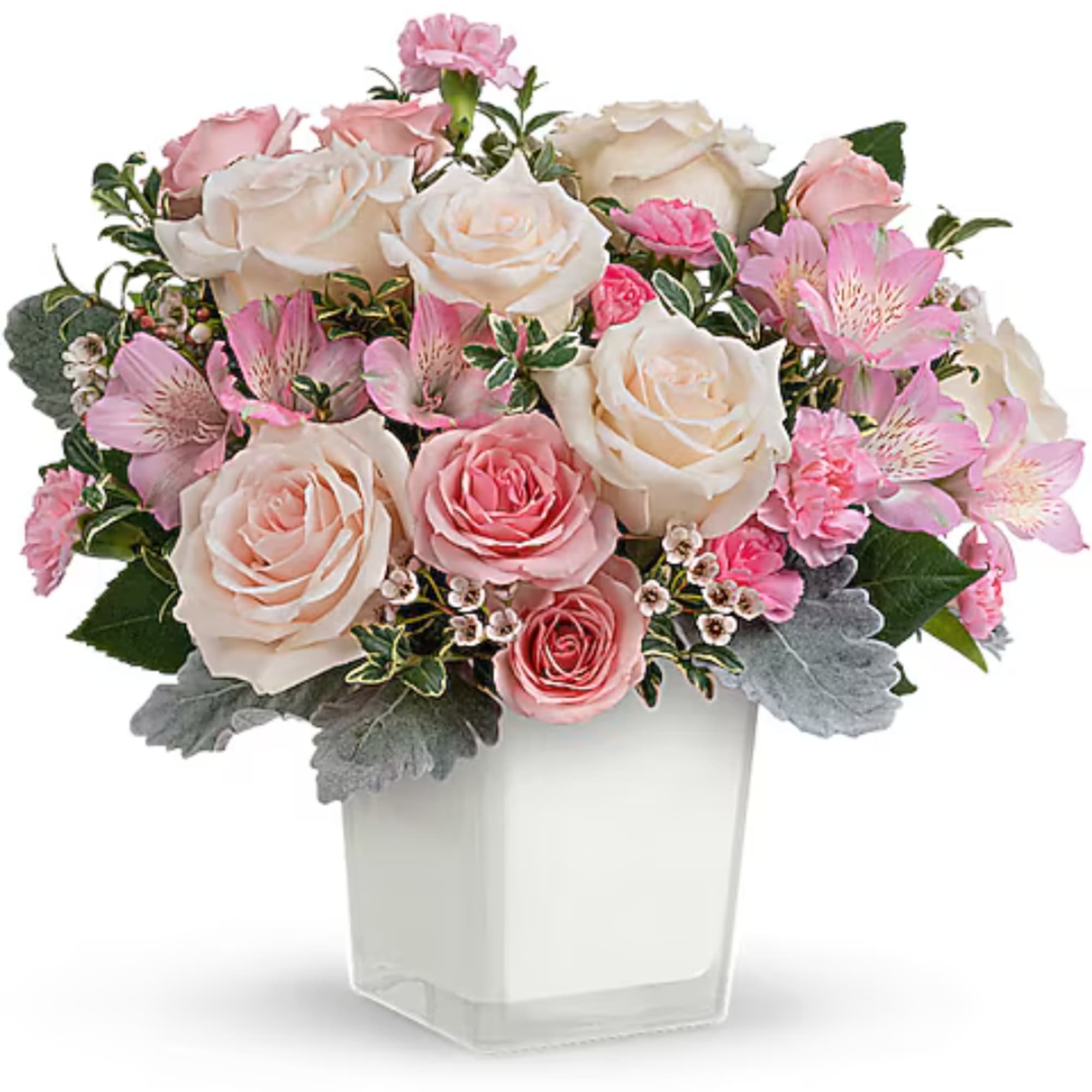 Pink and cream rose bouquet in a clear square vase