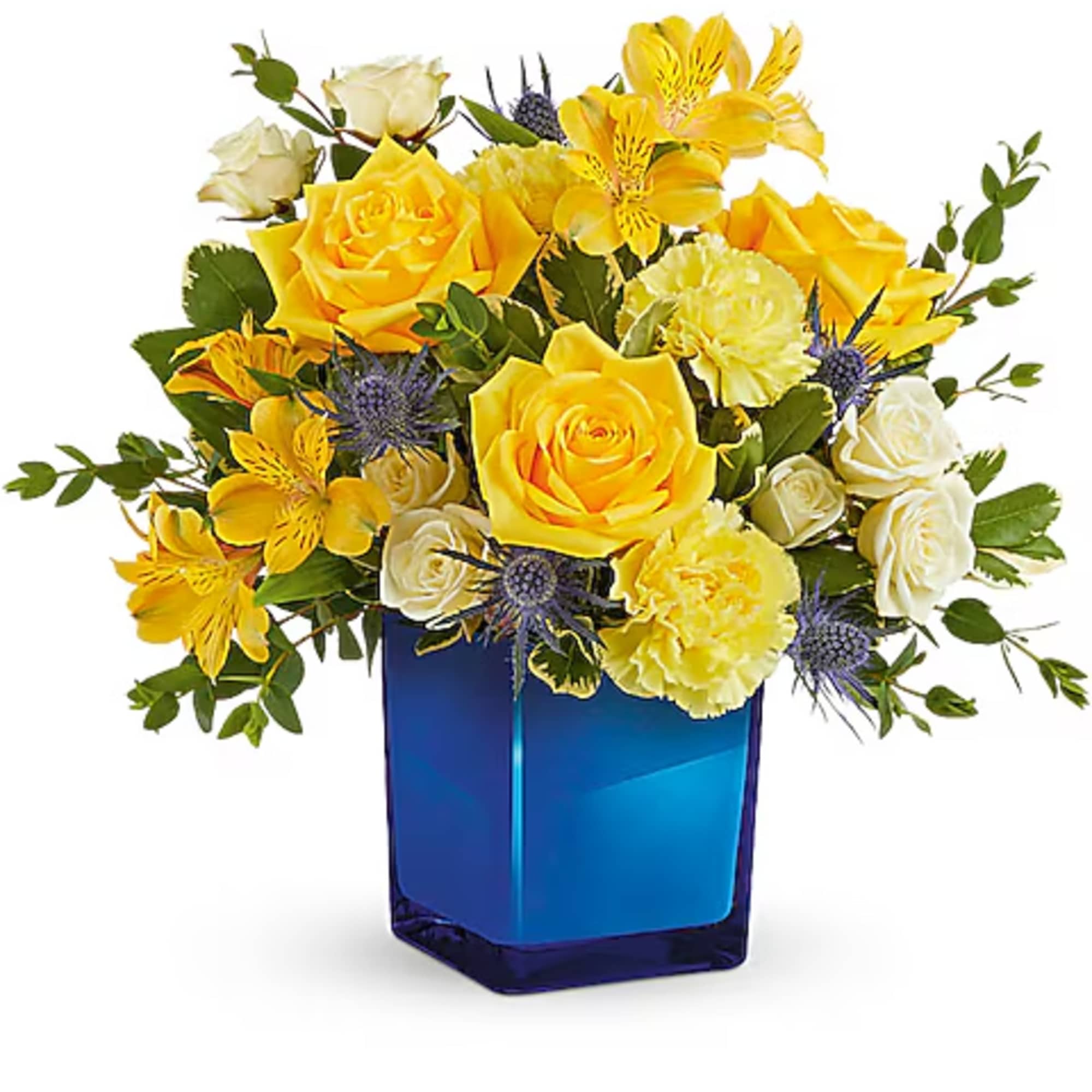 Yellow and white flower arrangement in a blue glass vase