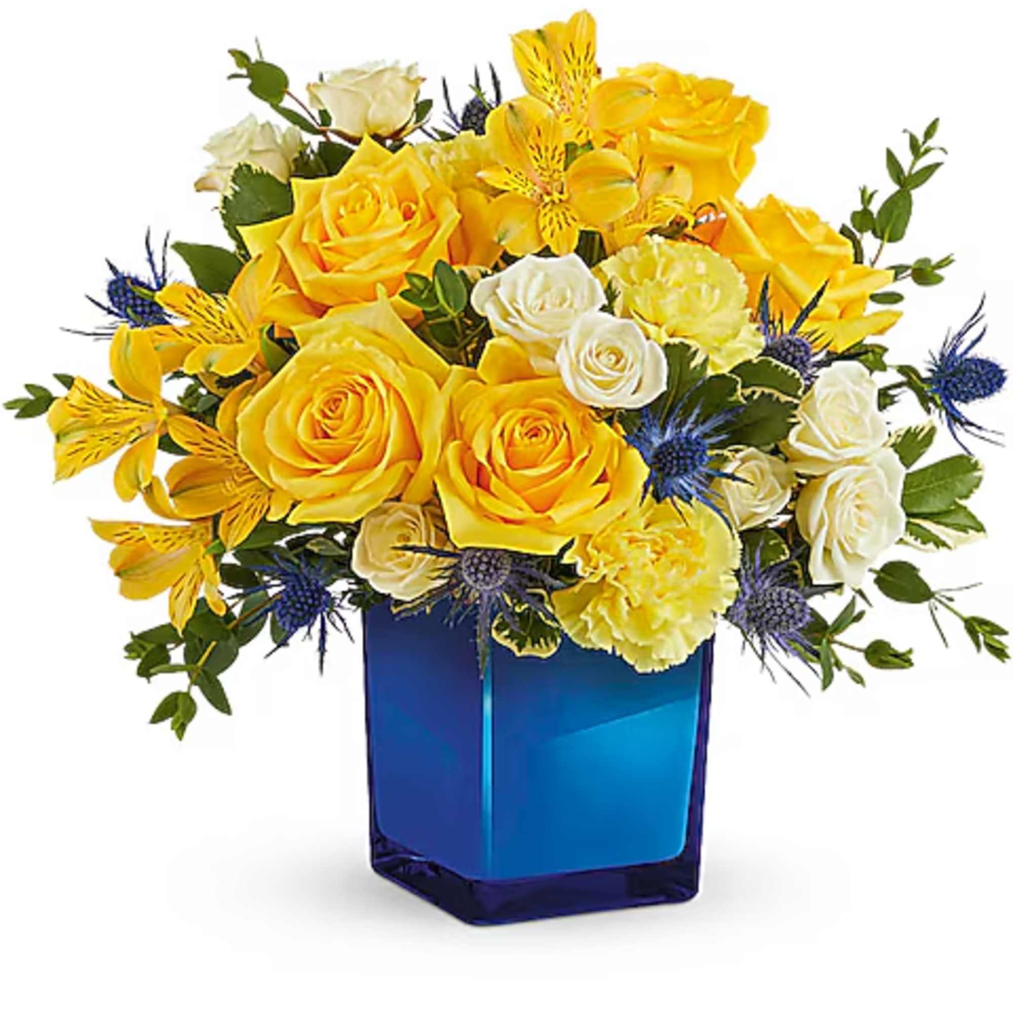 Yellow and white roses in a blue glass vase