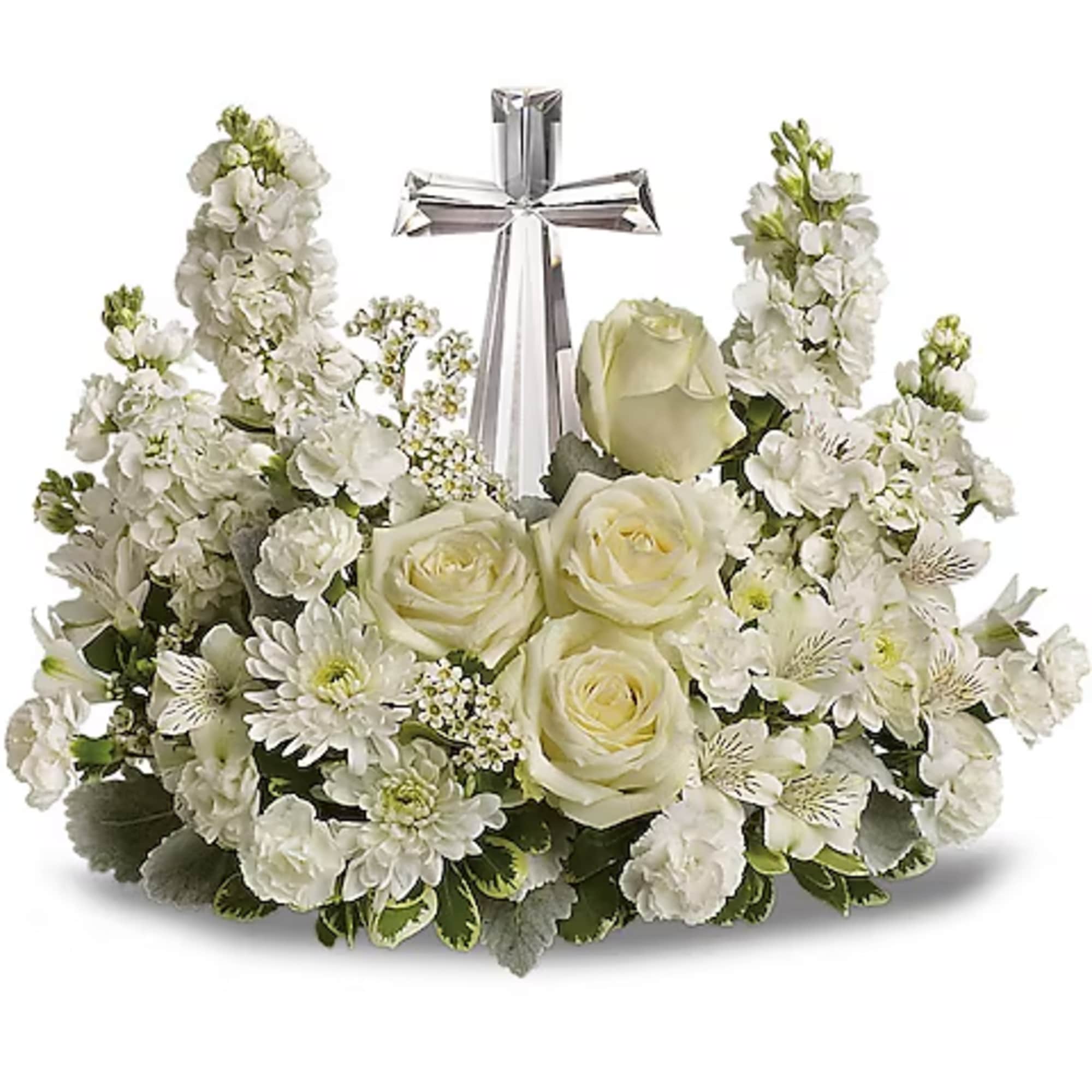 White floral arrangement with a silver cross centerpiece