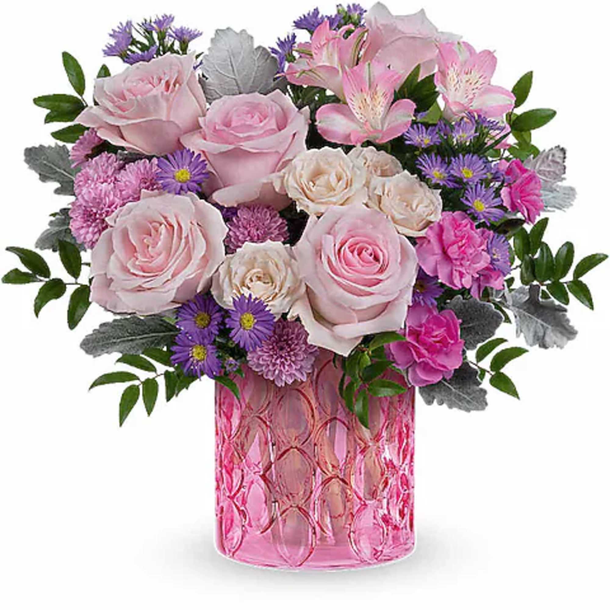 Pink and cream roses with purple flowers in a pink glass vase