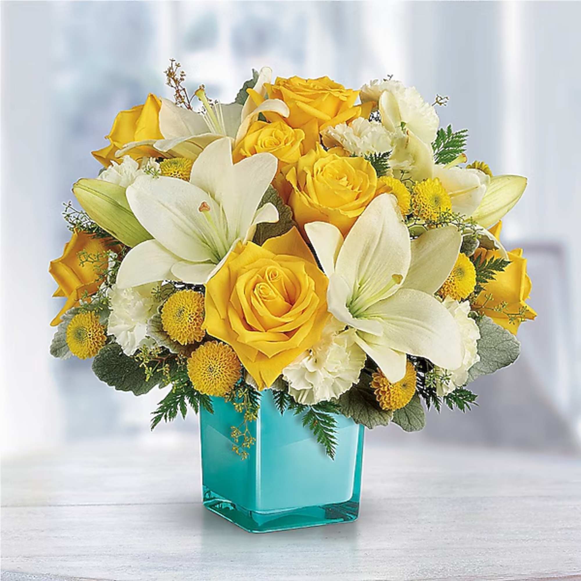 Yellow roses and white lilies in a turquoise glass vase, photo 2 of 2