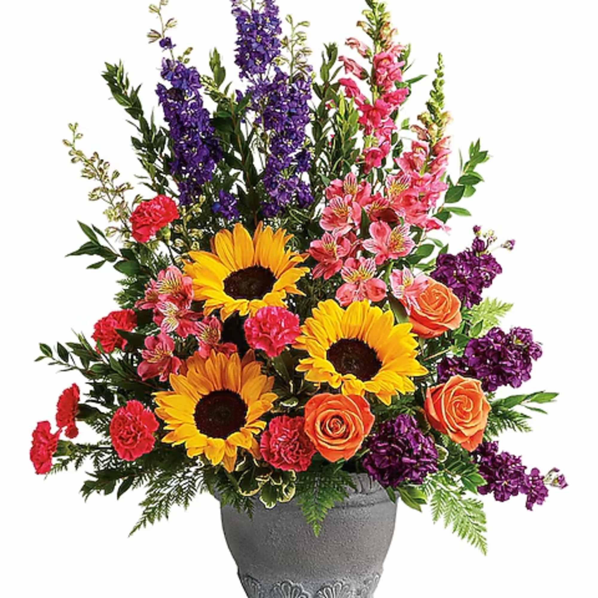 Colorful bouquet with sunflowers, roses, and purple blooms in a gray vase