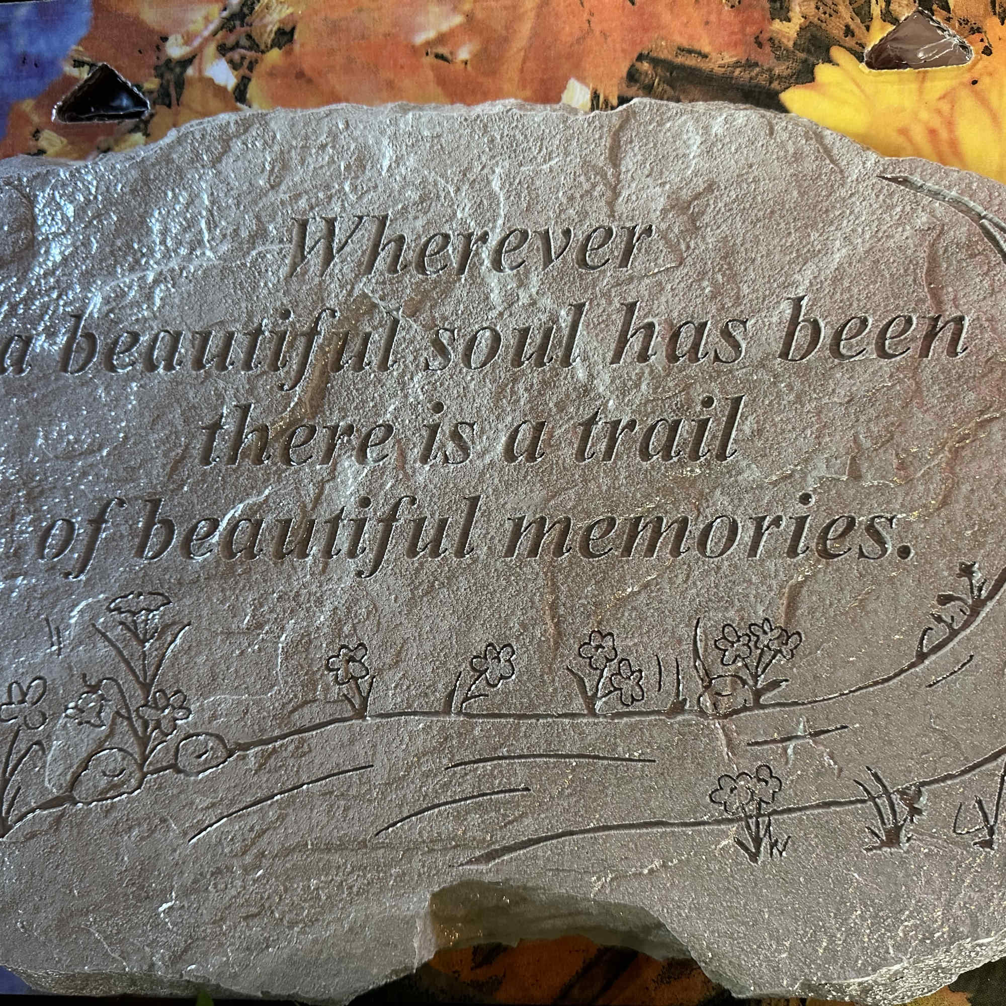 Engraved memorial stone with a sympathy quote