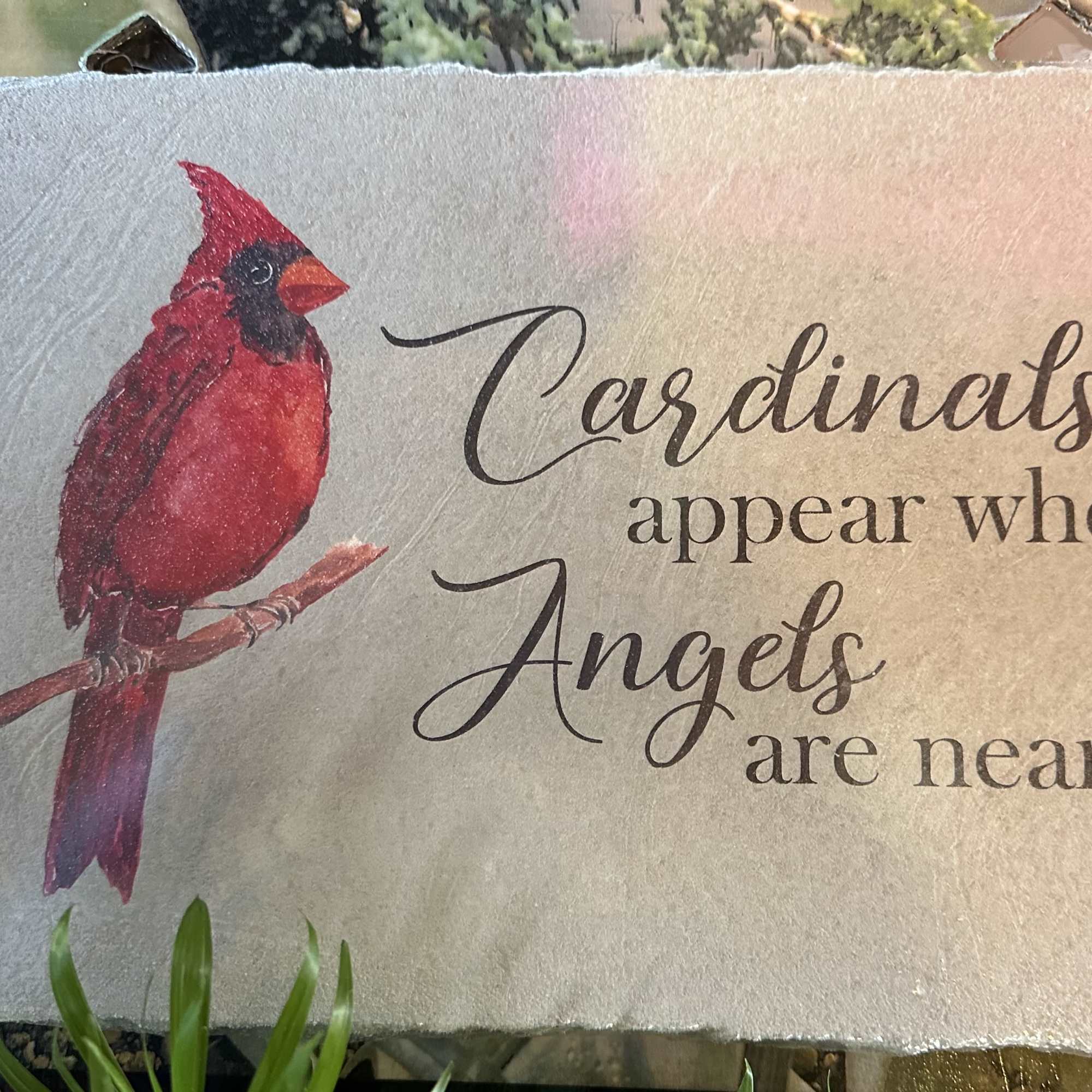 Decorative stone plaque with a cardinal and the words "Cardinals appear when Angels are near"